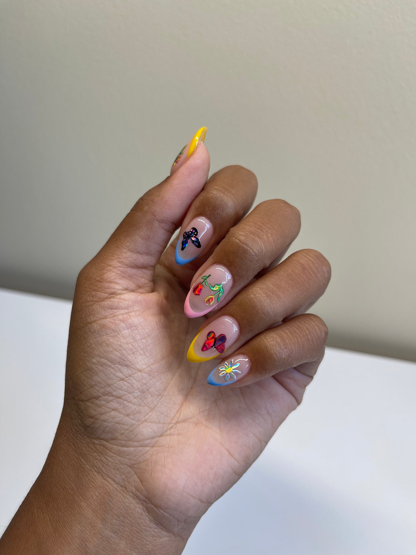 Multi colored french tips with holo stickers on