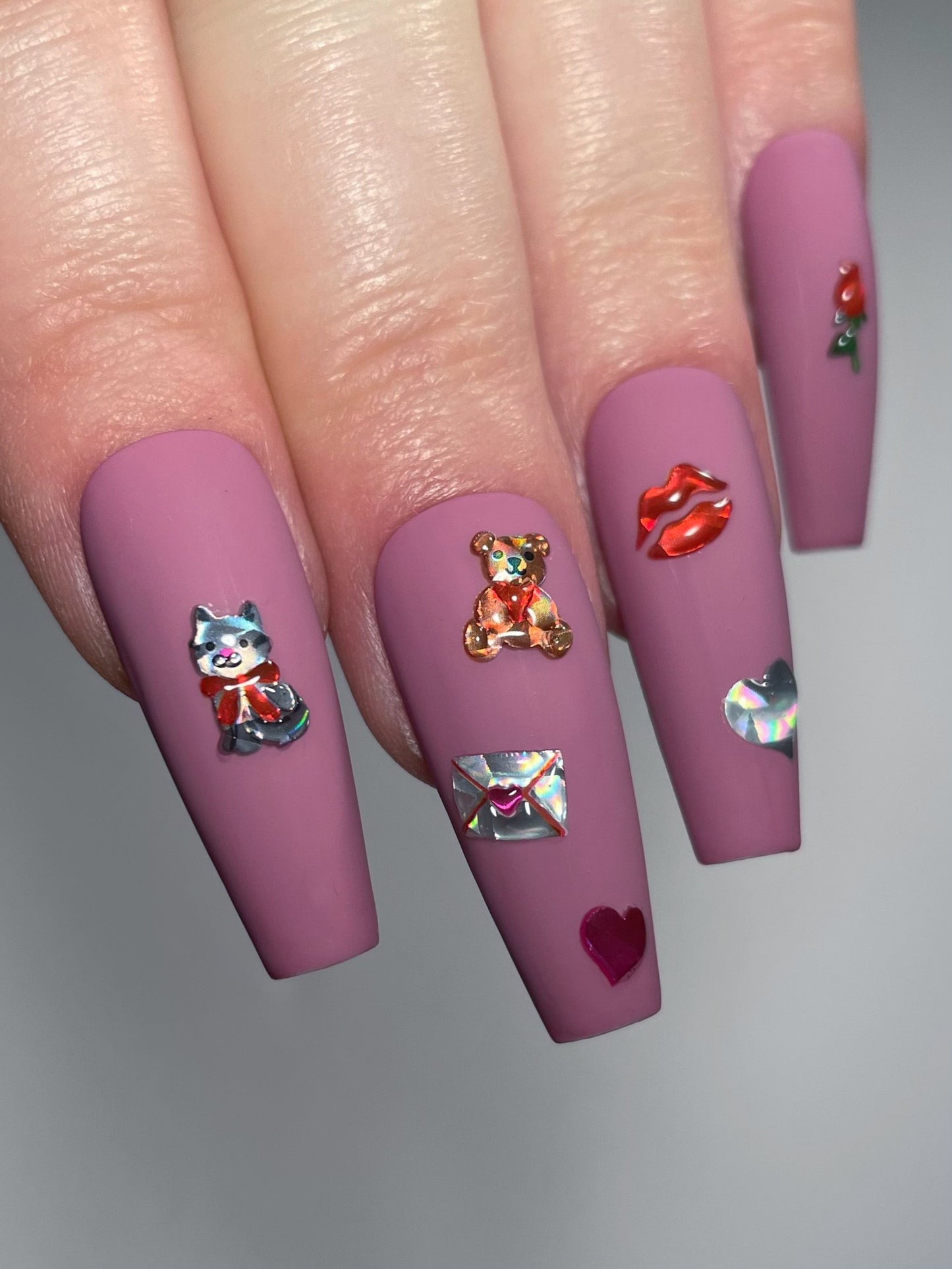 Teddy Bear stickers on matte pink nails