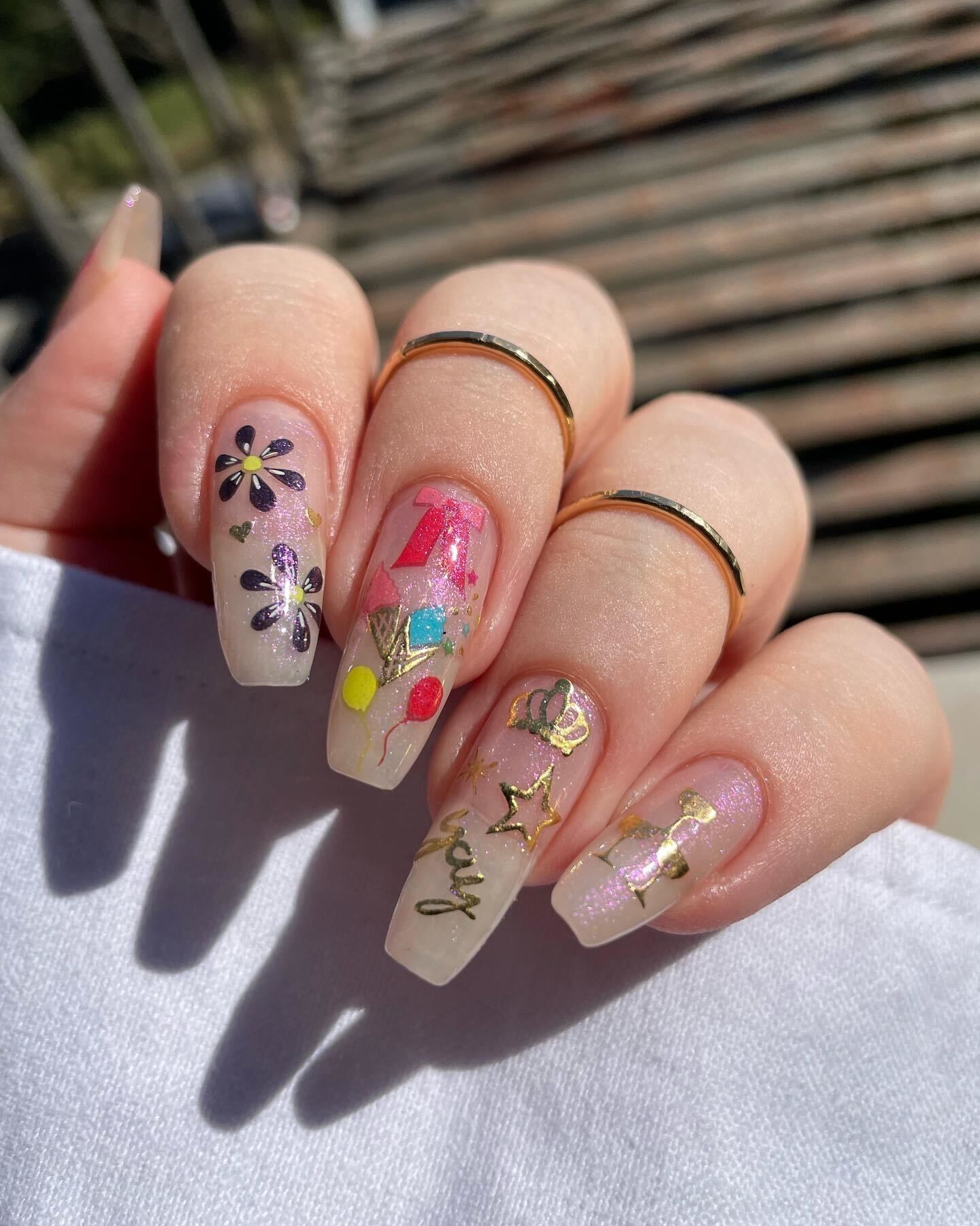 Birthday nail look on purple sparkle