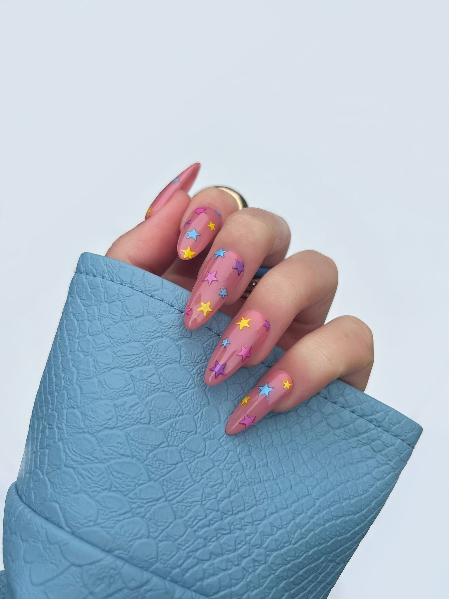 Lucky charm nail stickers on nude nails