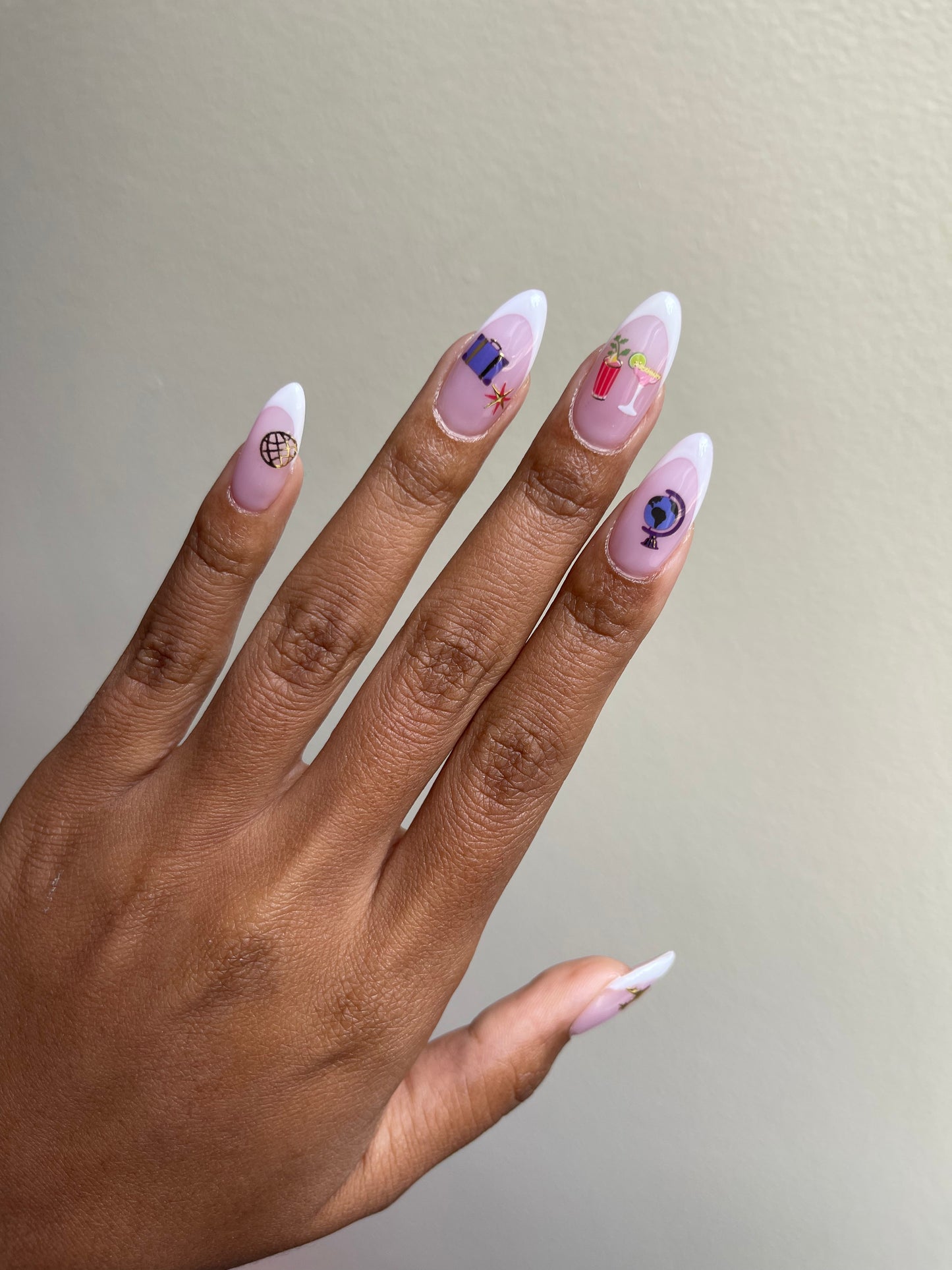 French tip nails with Jetsetter stickers on