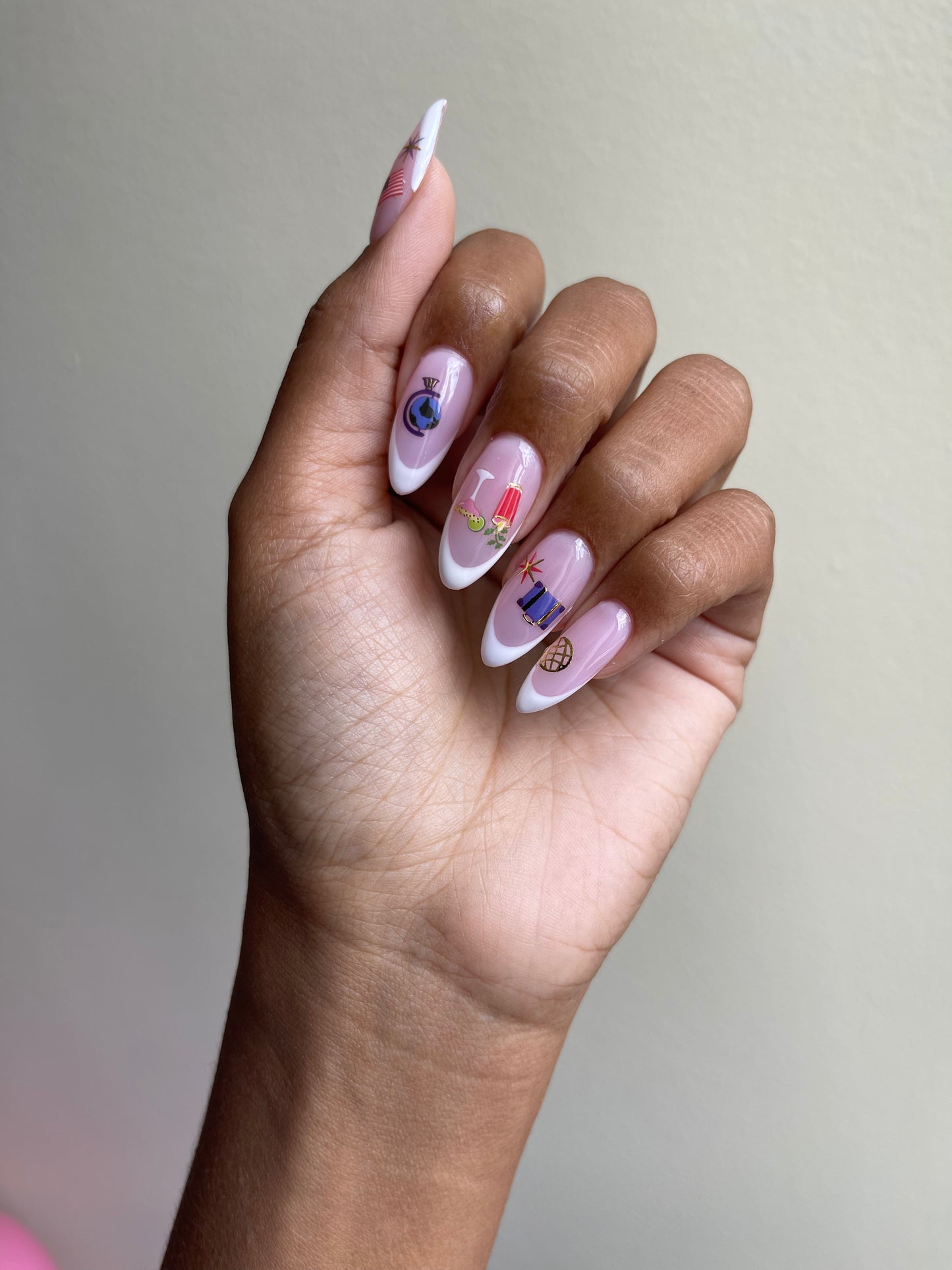French tip nails with Jetsetter stickers on
