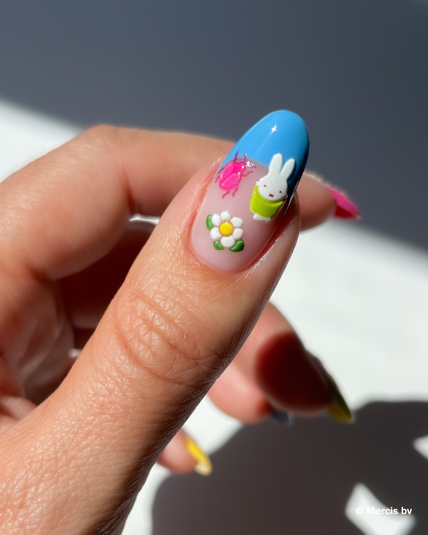 Nail with blue french tip and puffy miffy stickers