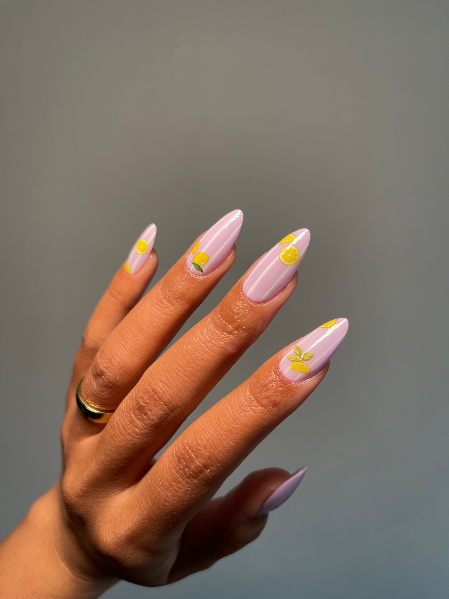 Pink chrome nails with lemon stickers