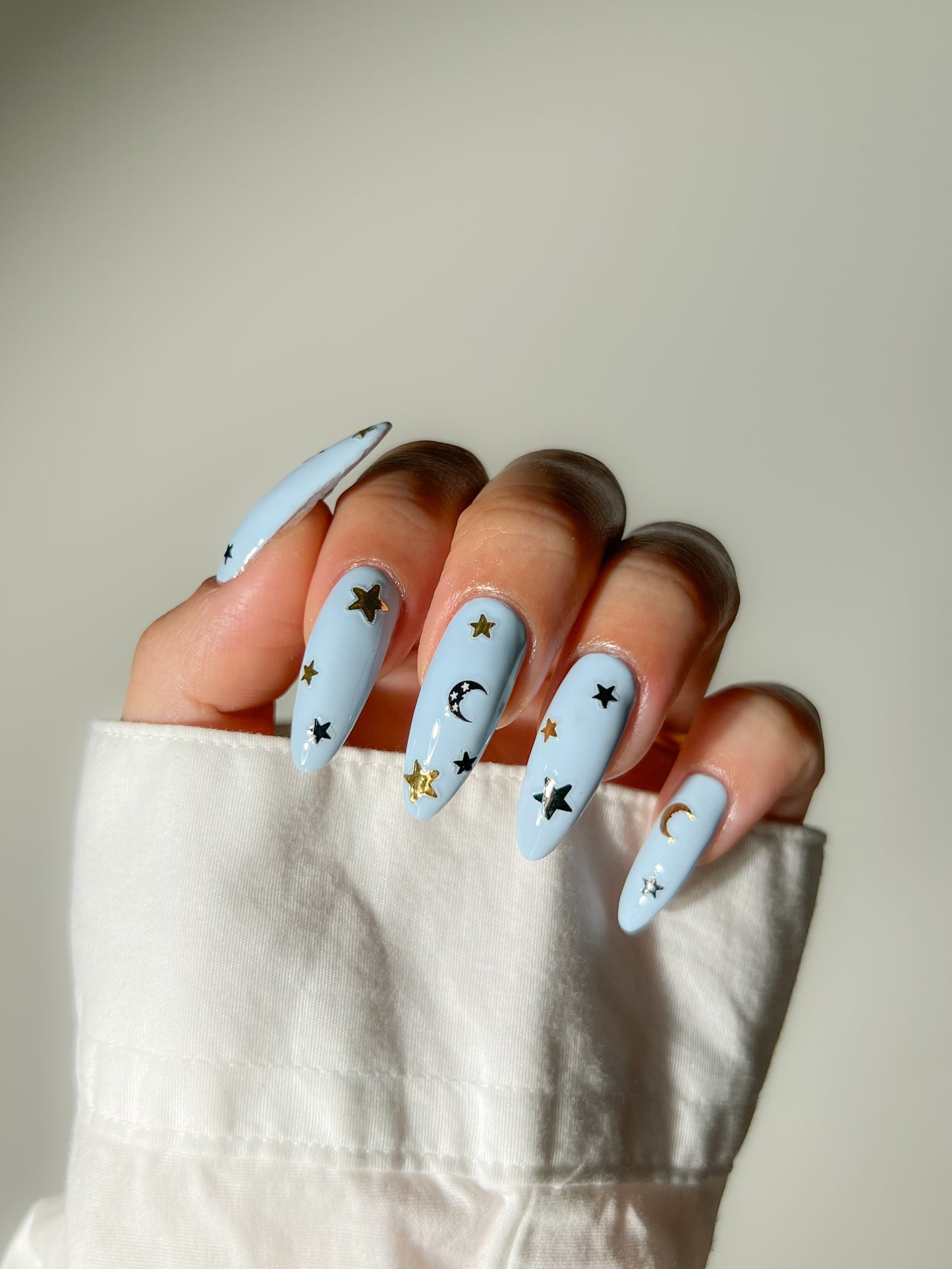 Retrograde stickers on blue nails