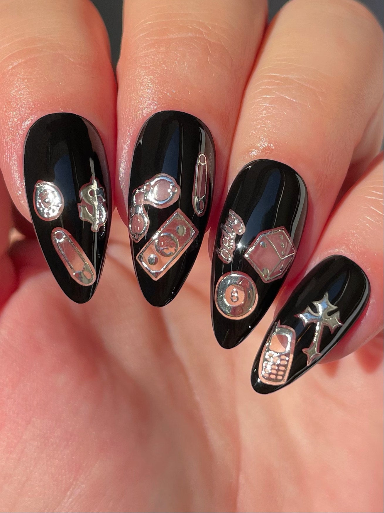 Black nails with silver stickers
