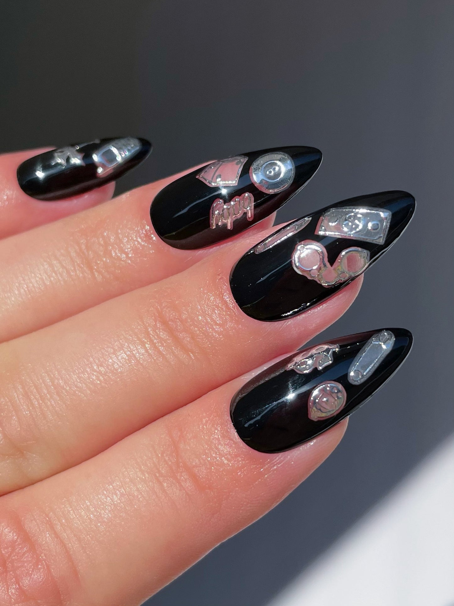 Black nails with silver stickers