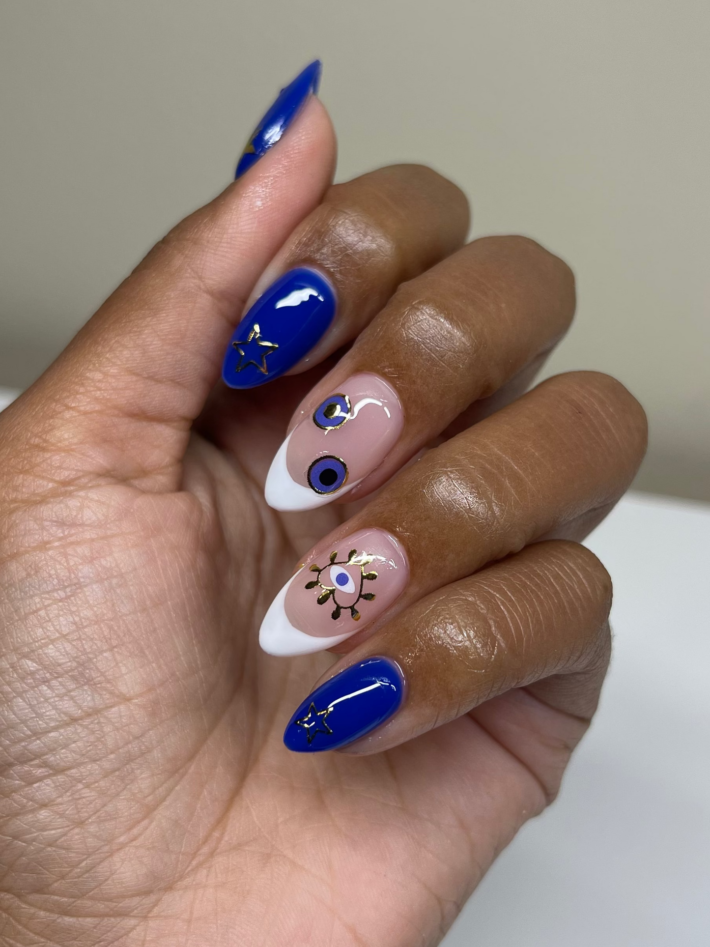 French tip and blue nails with stickers on