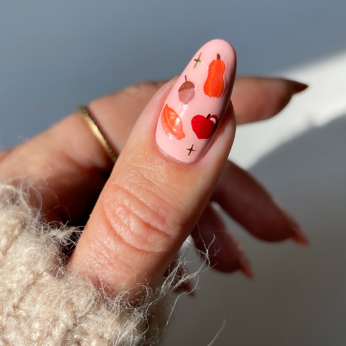 cozy stickerbook nails on a peachy base