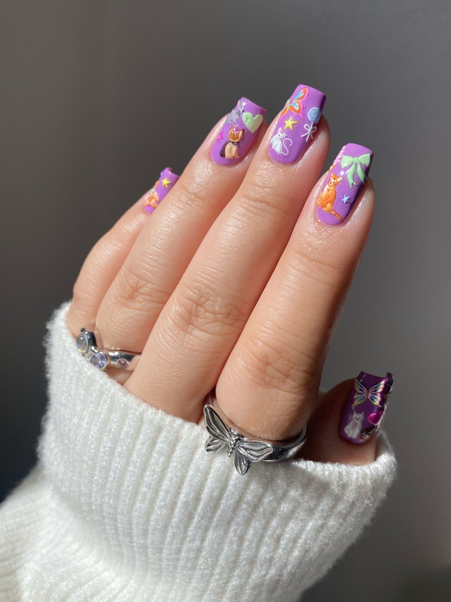 Pet Shop Nail Stickers on purple nails