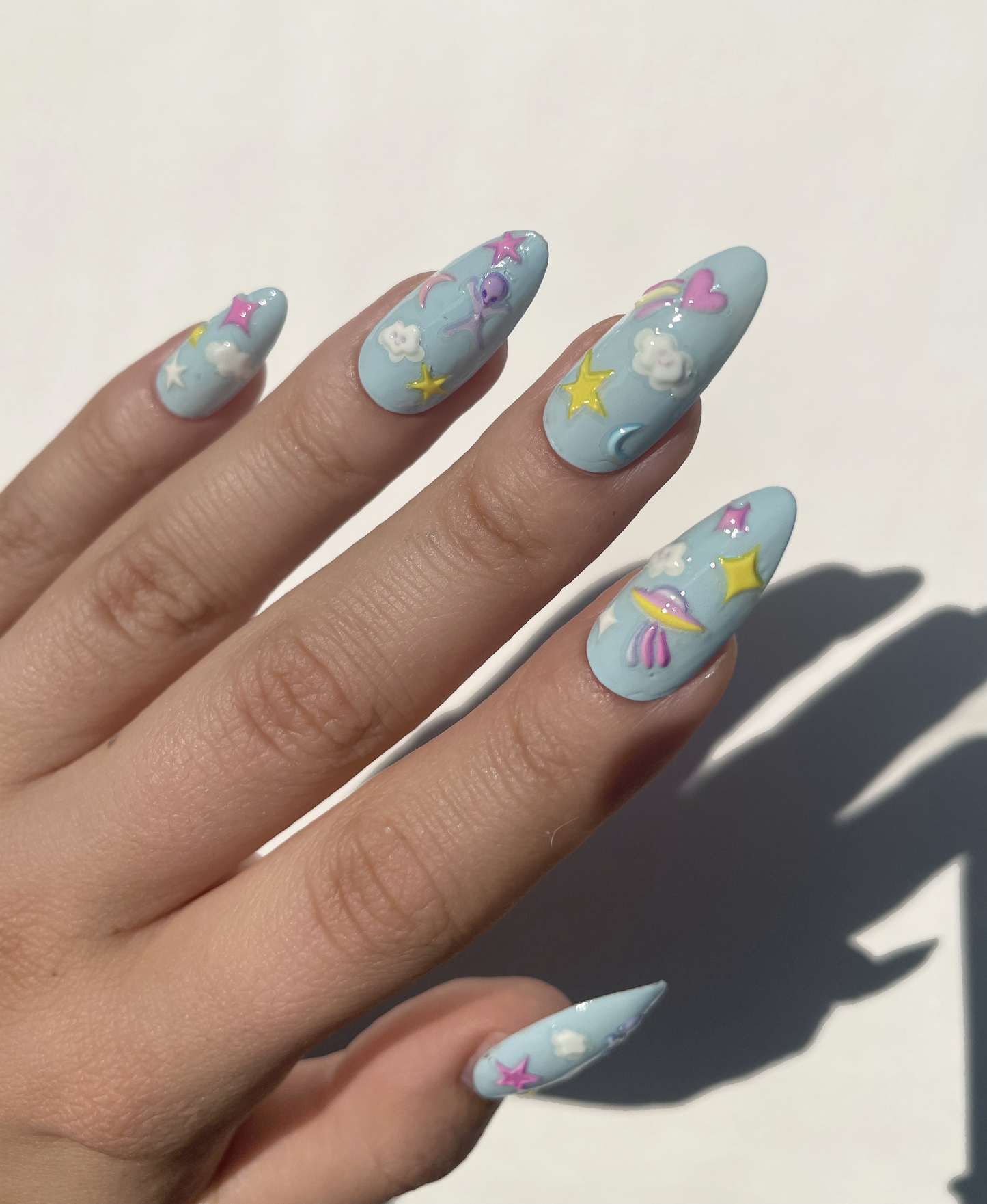 Spaced Out Nail Art Stickers on blue nails