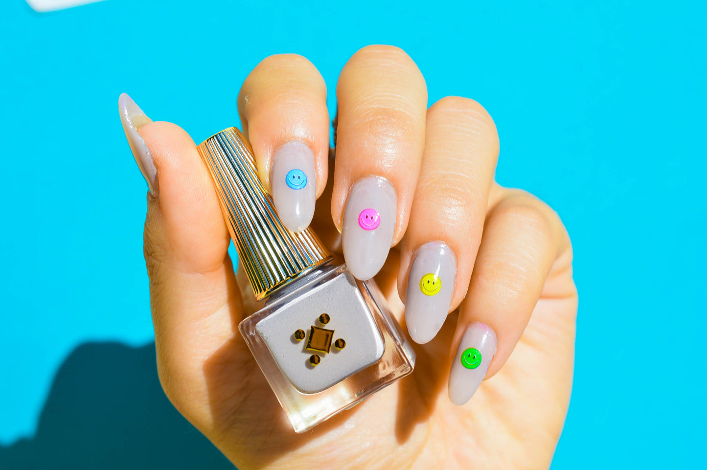grey nails with smiley face art