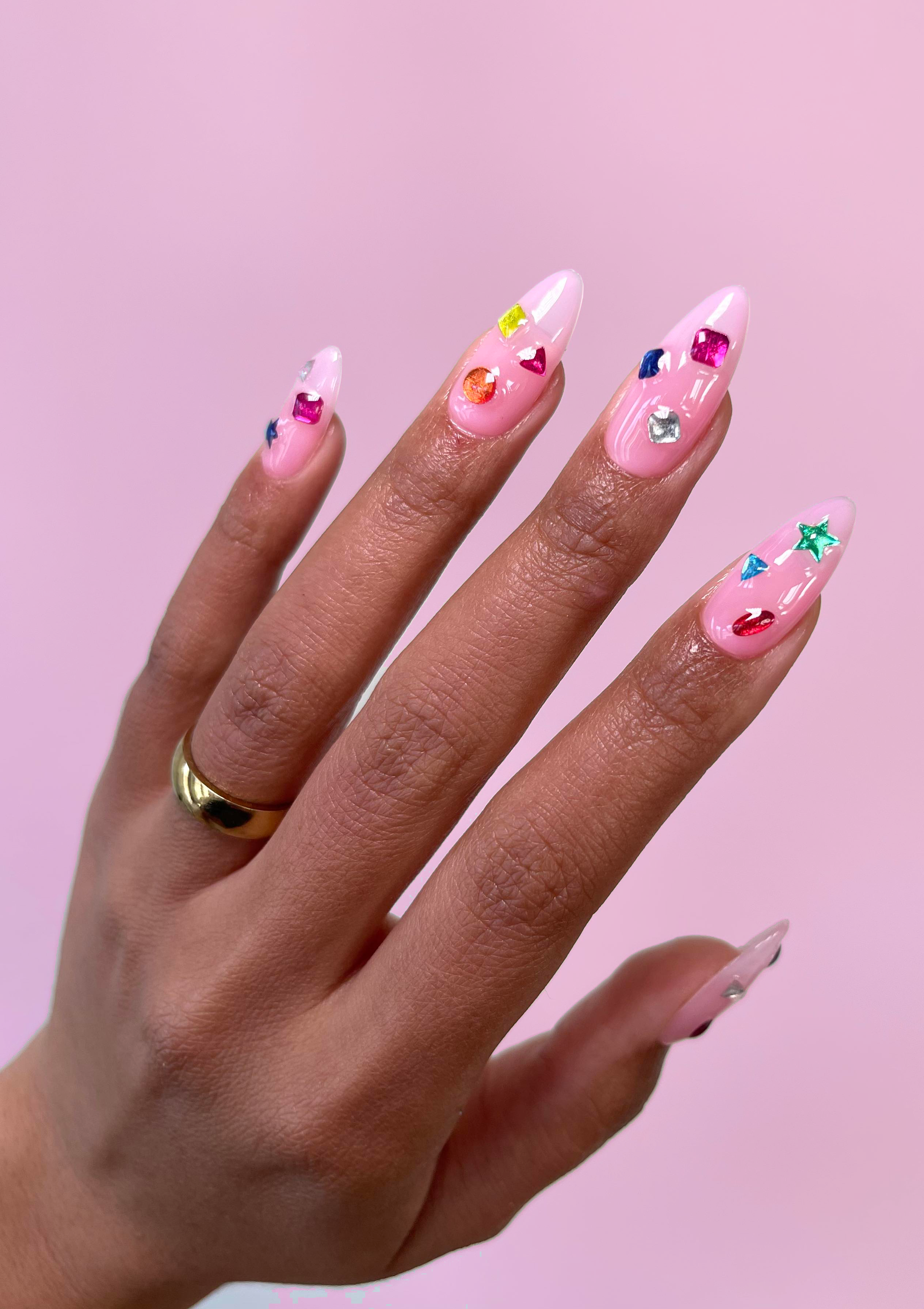 90s baby gems on pink nails