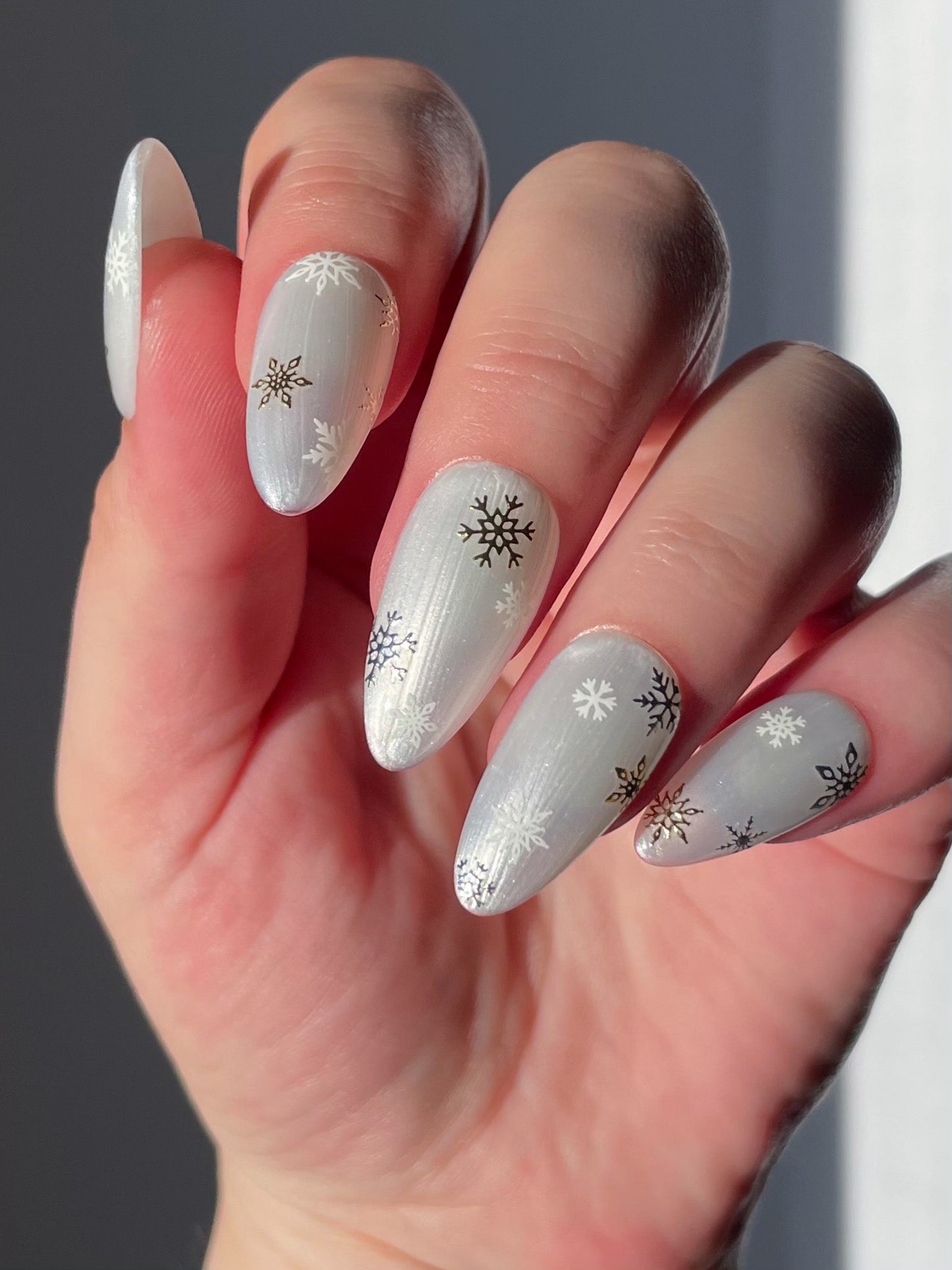 Snowfall stickers on pearl white nails