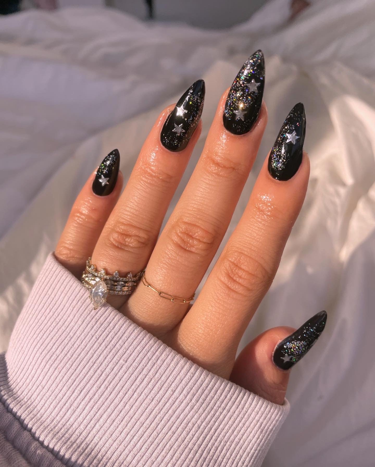 Silver nail art stickers on black nails