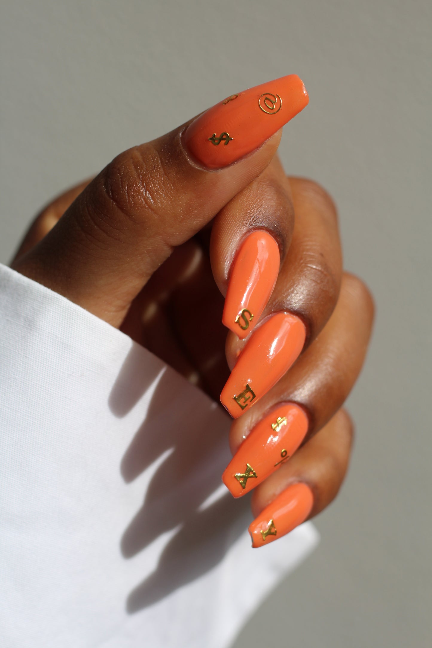 ABCS nail art on orange nails, SEXY
