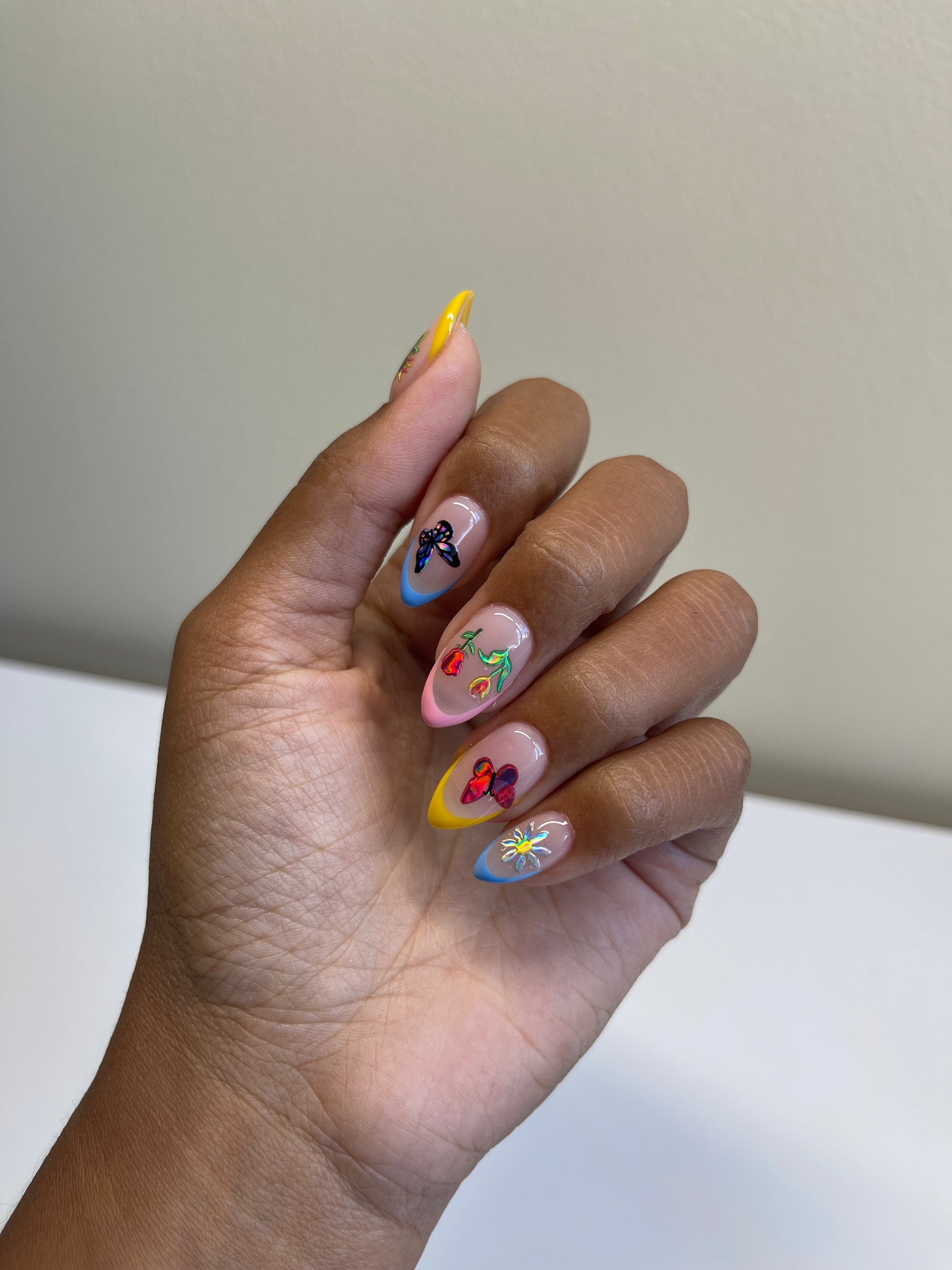 Multi colored french tips with holo stickers on