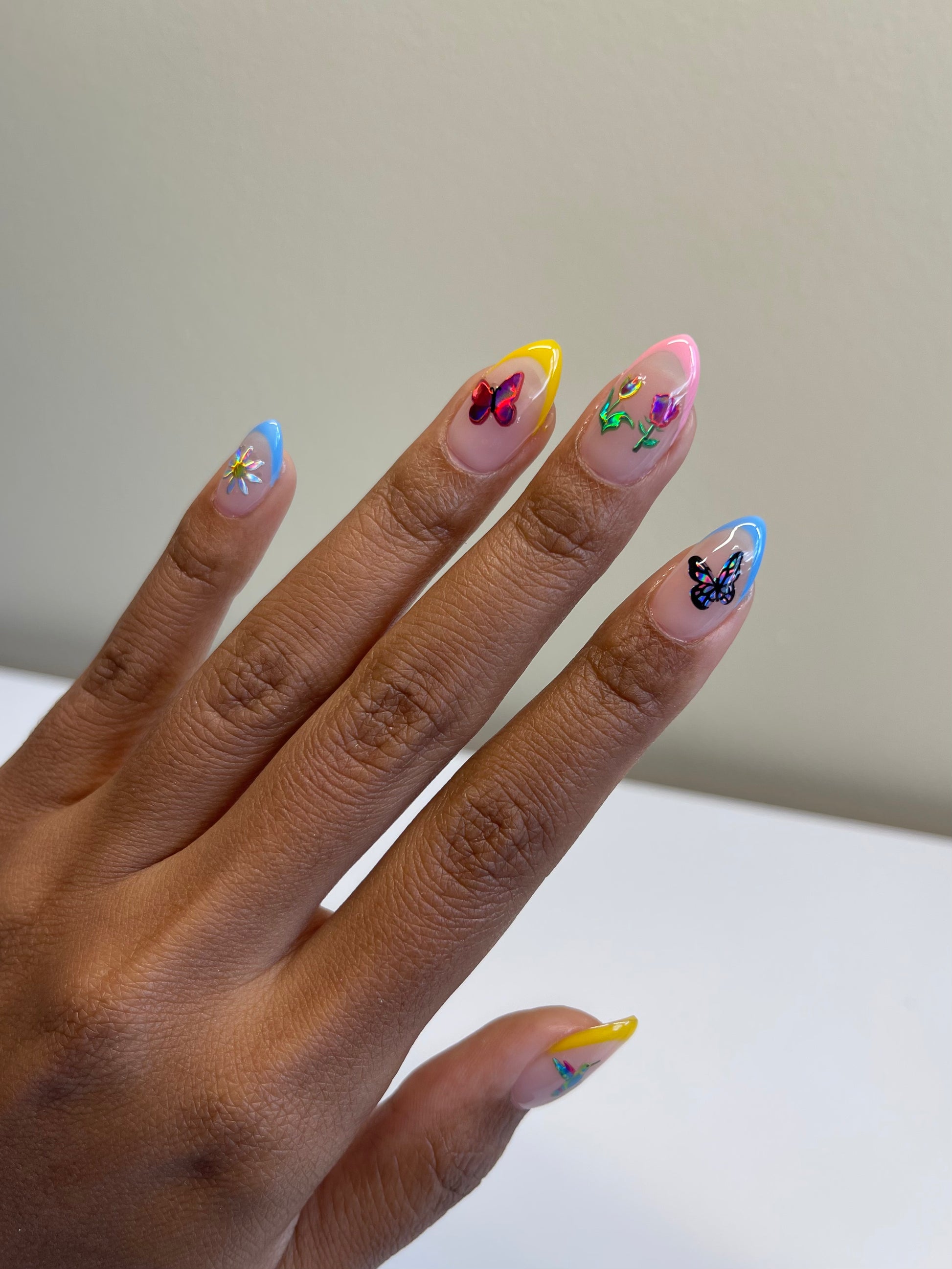 Multi colored french tips with holo stickers on