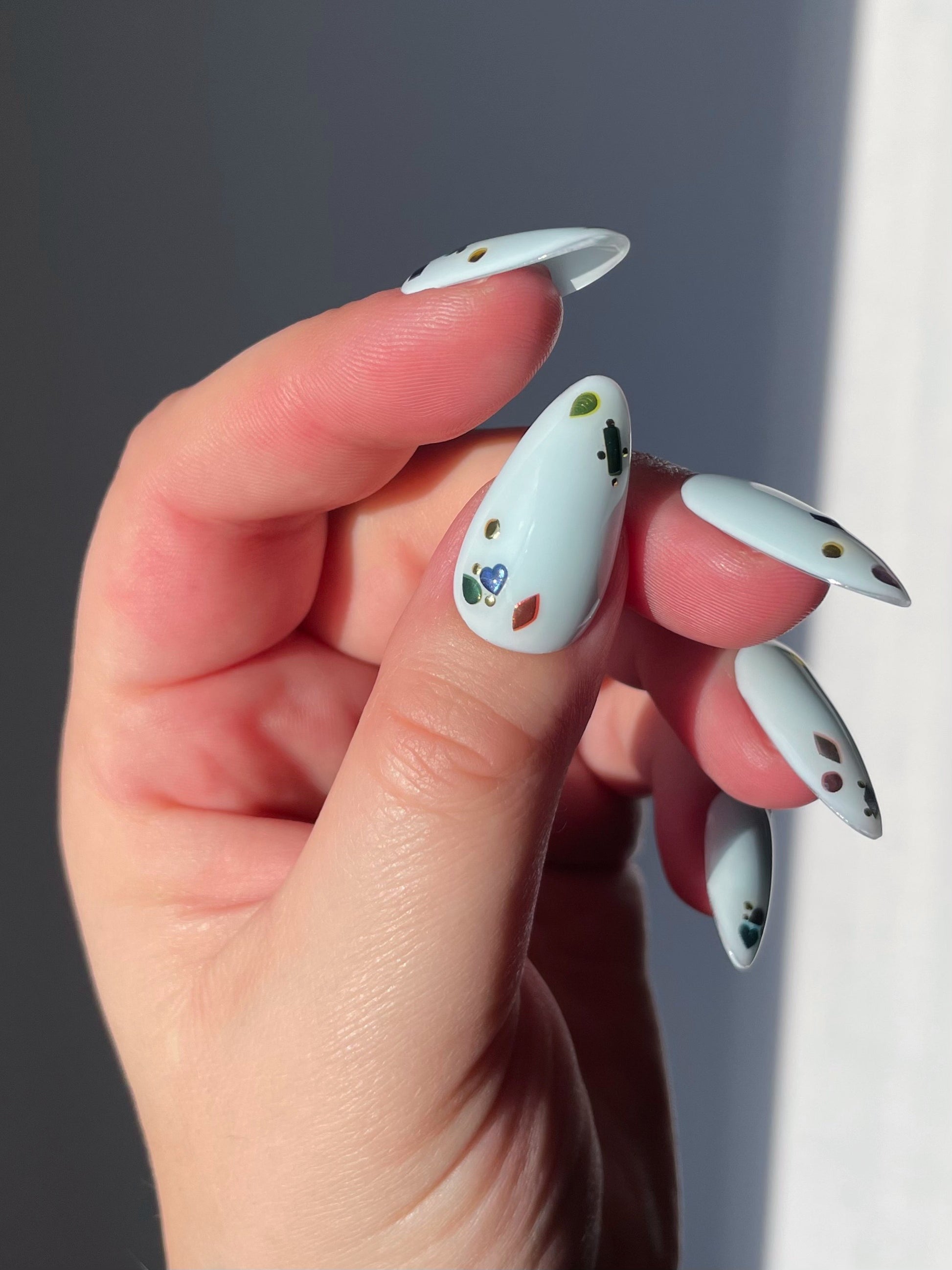 Topaz stickers on a light blue nail