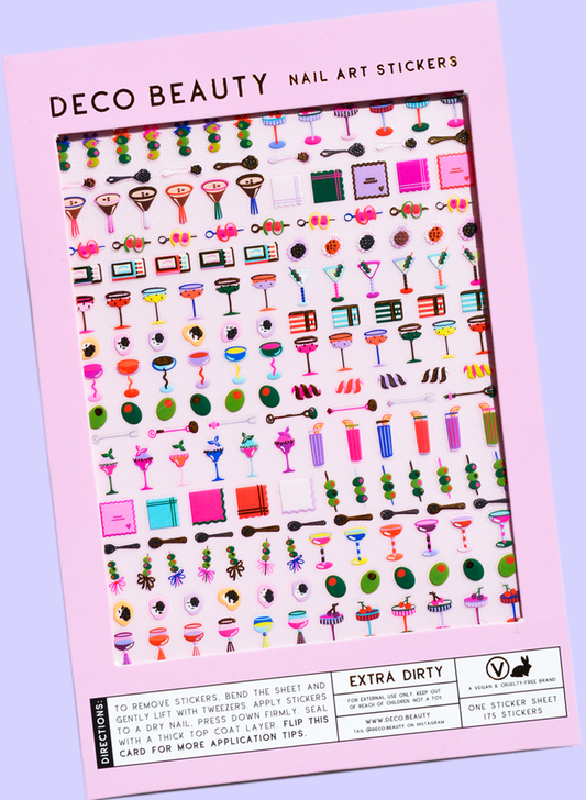 Extra Dirty nail art stickers flat lay on a purple background