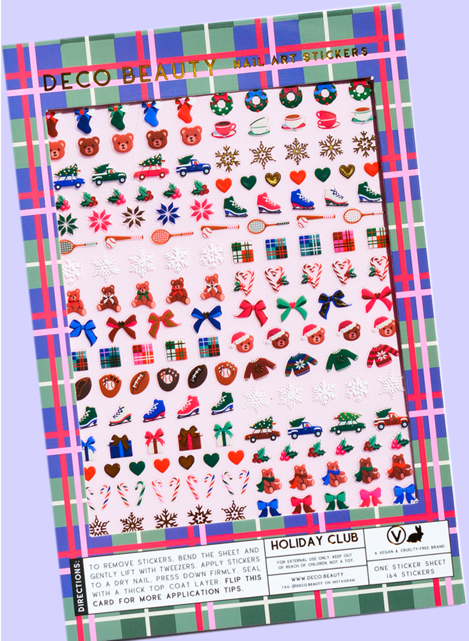 Holiday Club nail art stickers flat lay on a purple background