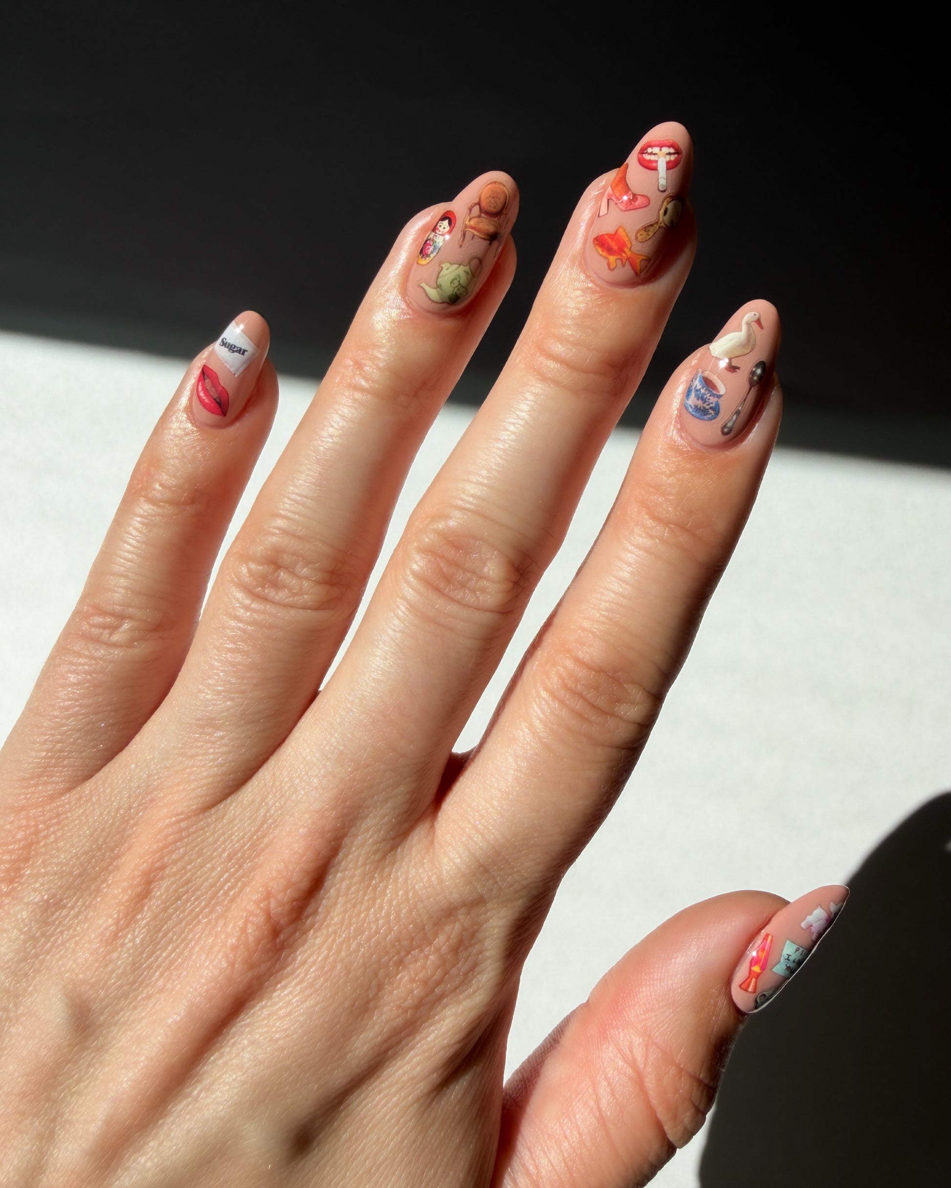 Nail art stickers on nude nails