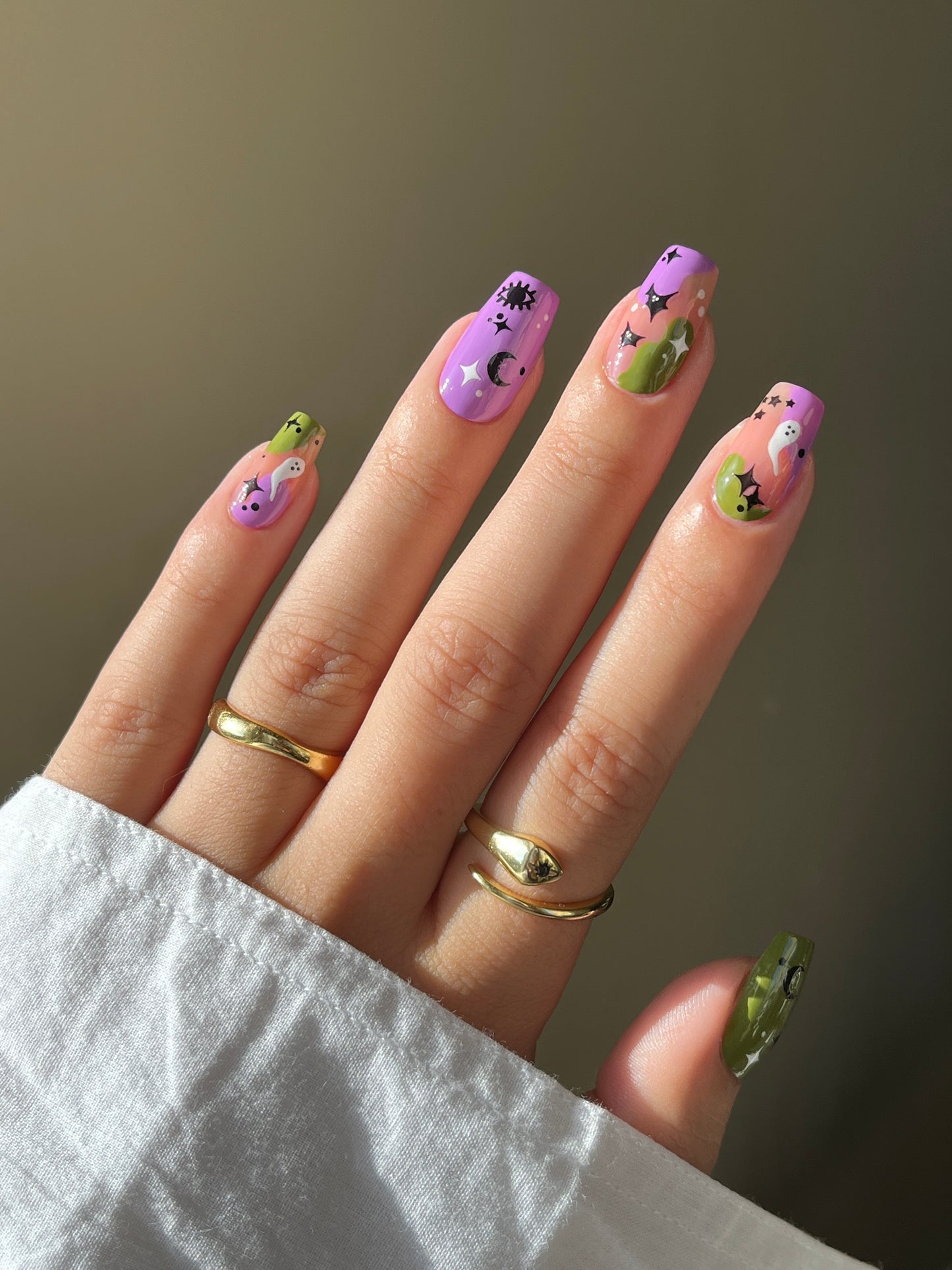 Spooky Nail Art Stickers on purple and green nails