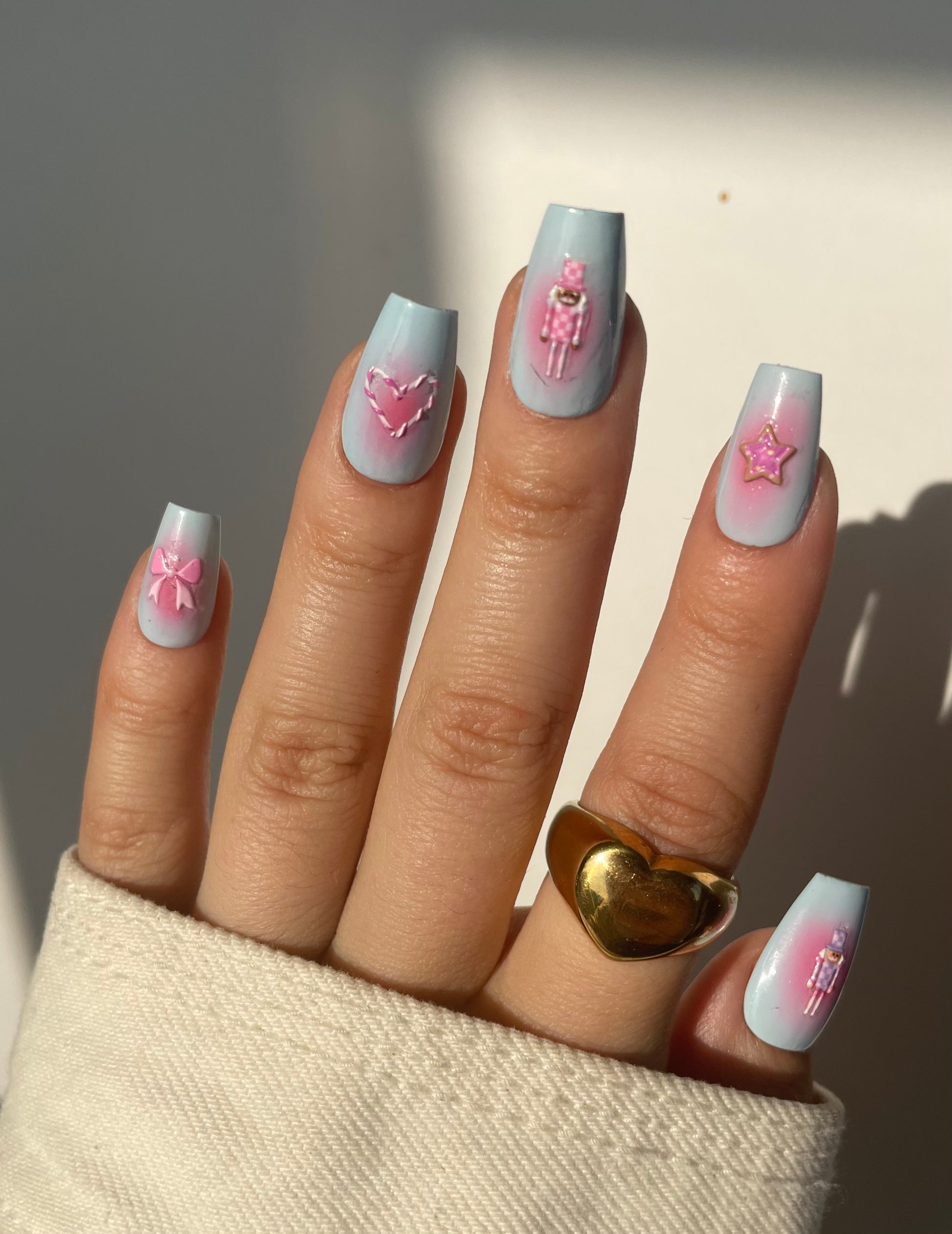 Gingerbread men stickers on blue nails