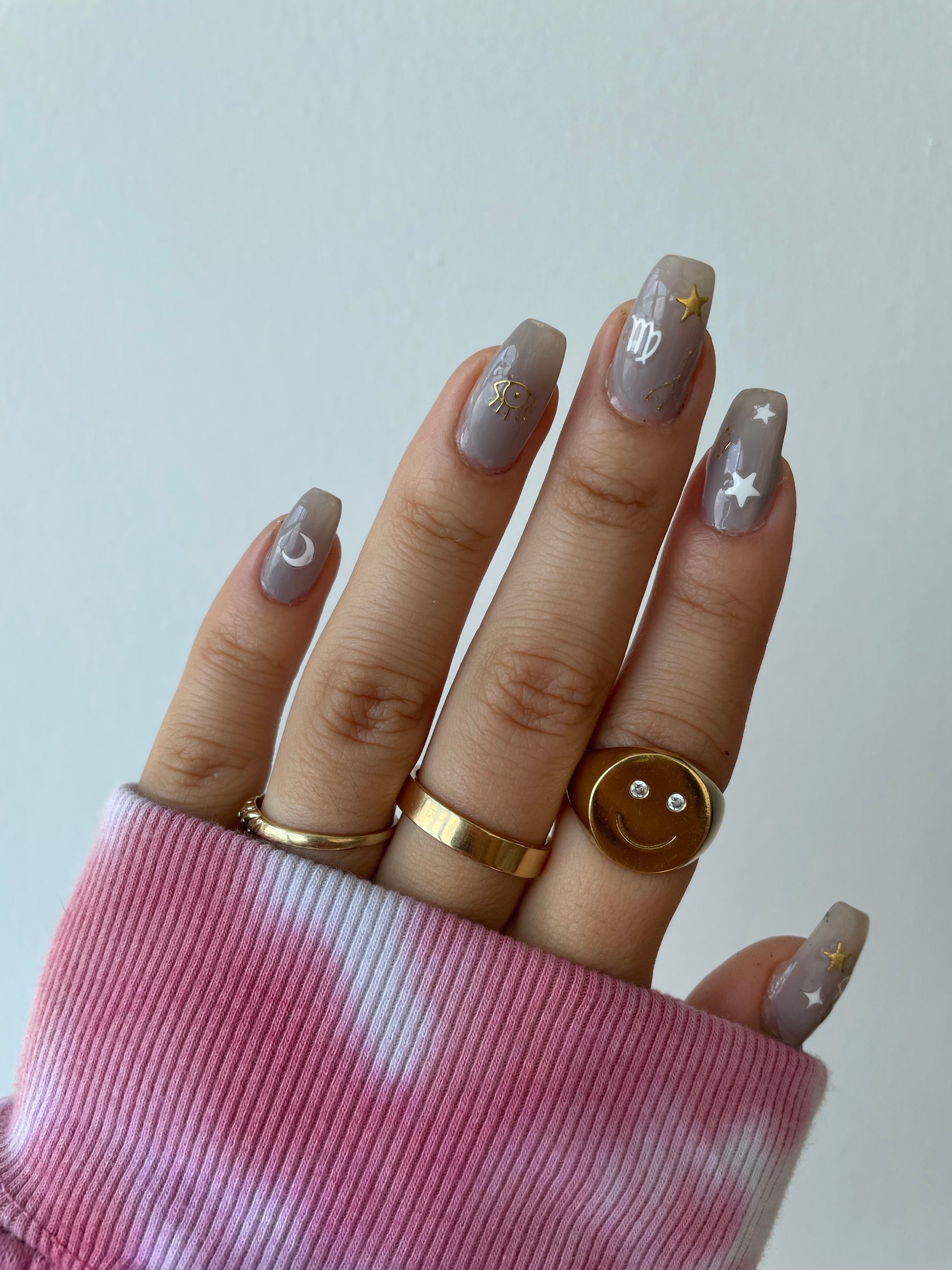 Zodiac nail art stickers on grey nails