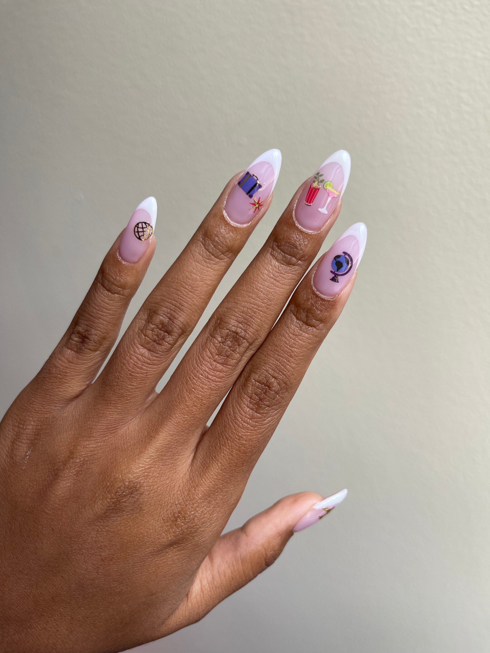 French tip nails with Jetsetter stickers on