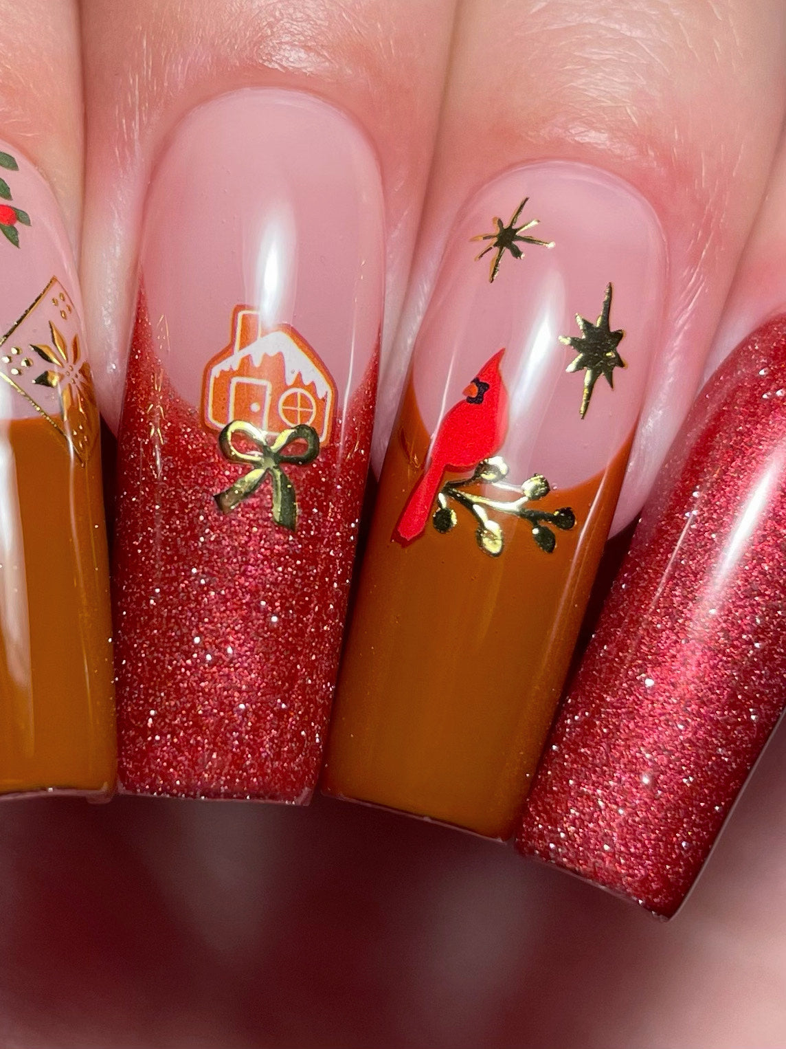 Deco The Hall stickers on brown and red french nails