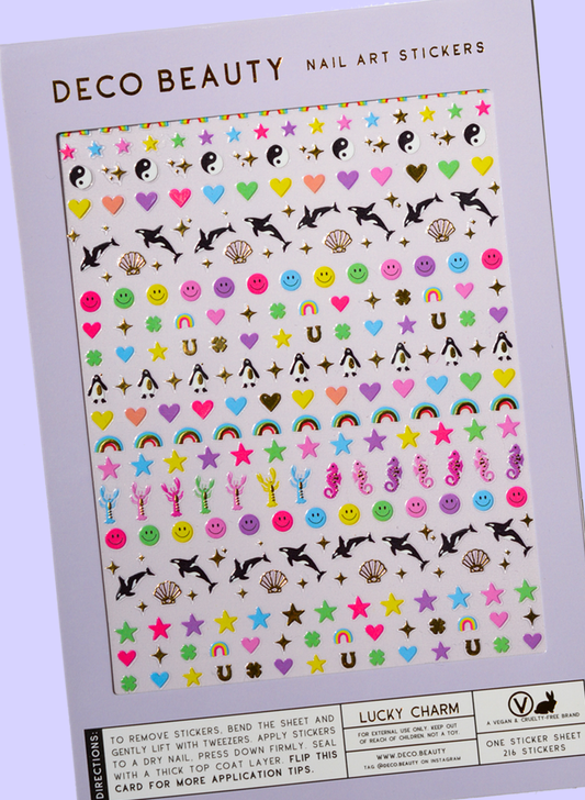 Lucky Charm stickers, featuring orcas and lucky shapes in rainbow colors