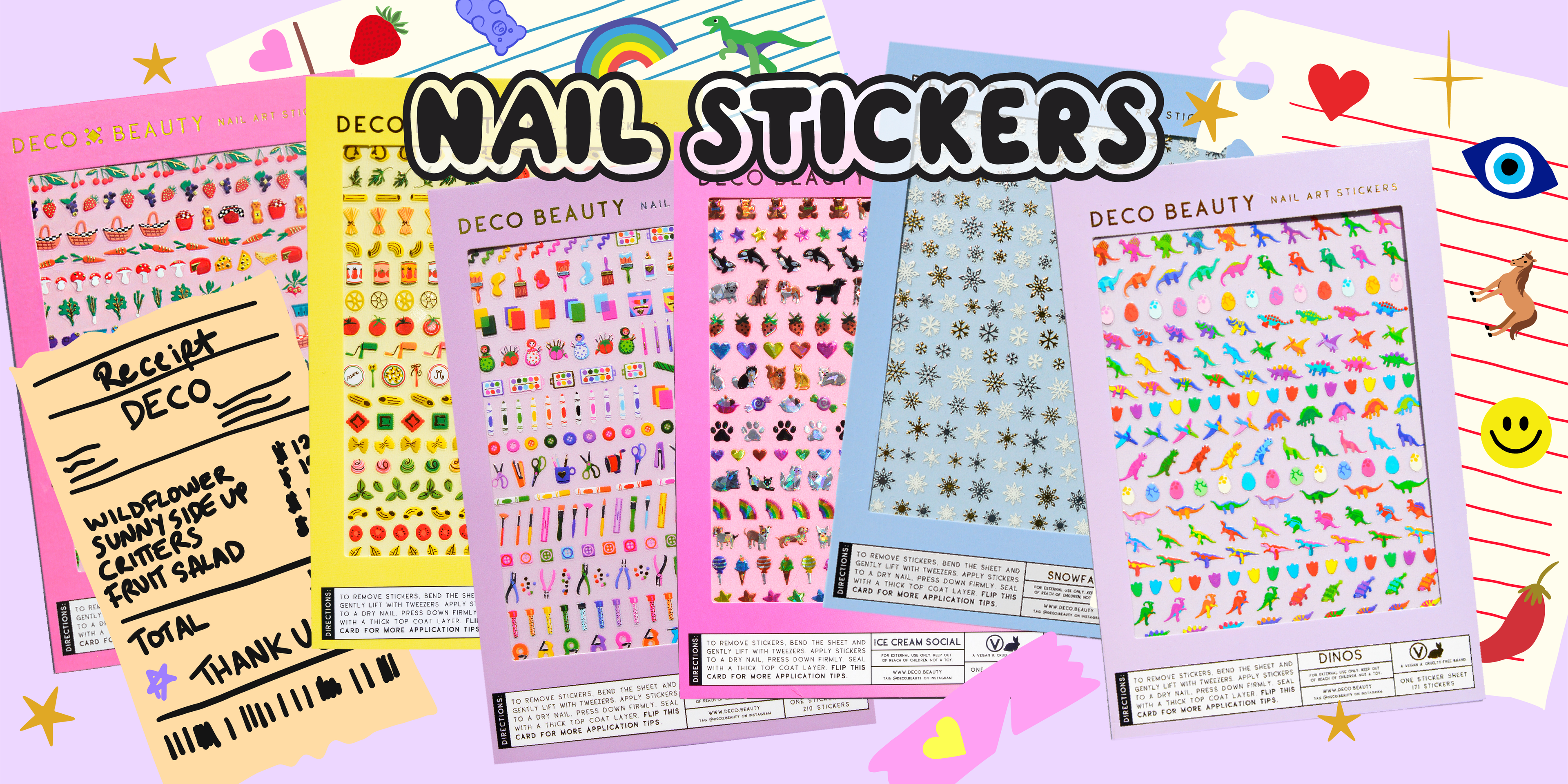 Banner of nail art stickers with crafty girl graphics like notebooks and recipes in the background, showing eclectic nail sticker designs scattered around like horses, smiley faces, peppers, rainbows.