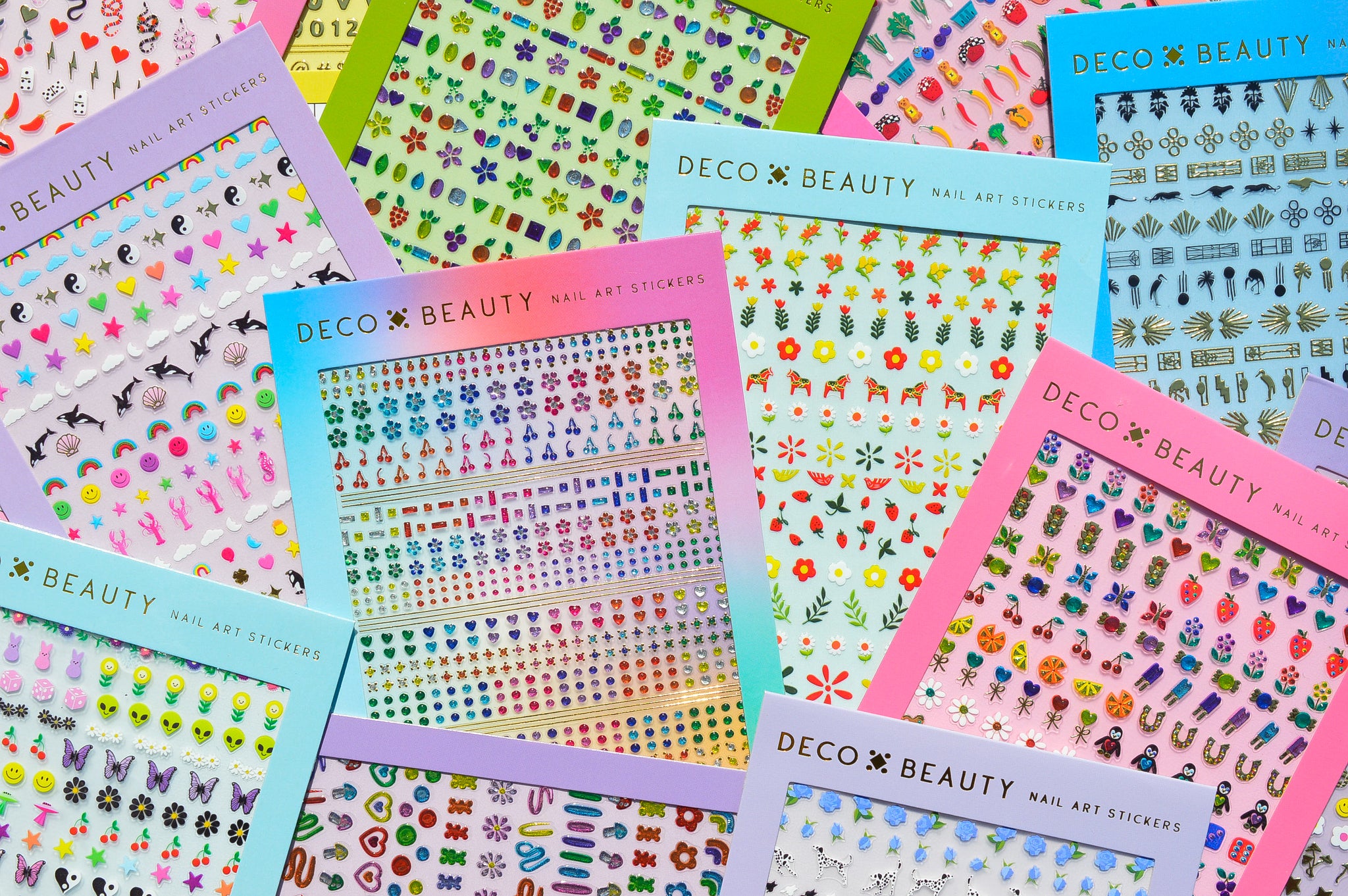 Flat lay of multiple colorful nail art sticker sheets