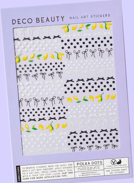 Polka Dots sheet flat lay slanted on purple background