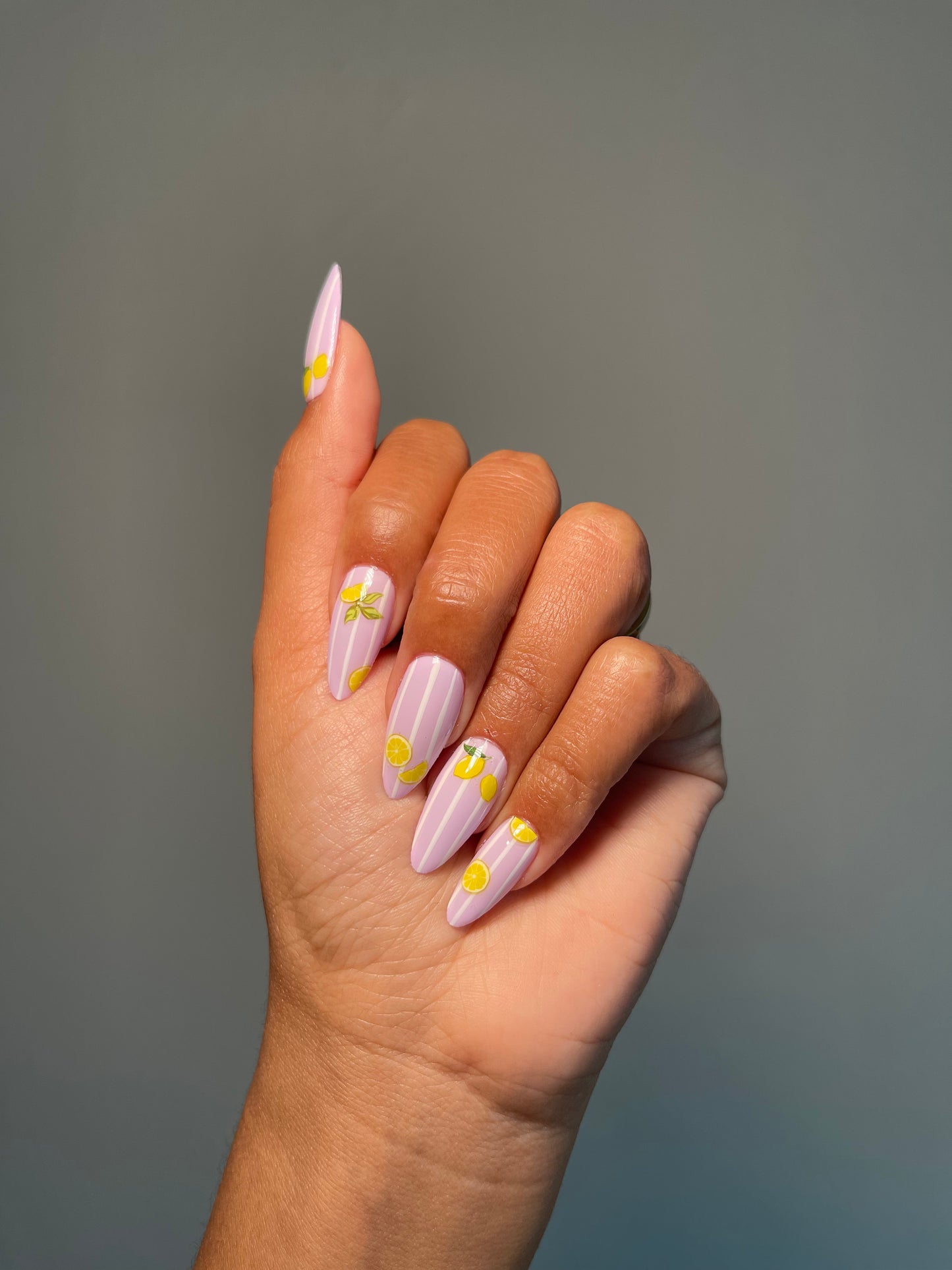 Pink chrome nails with lemon stickers