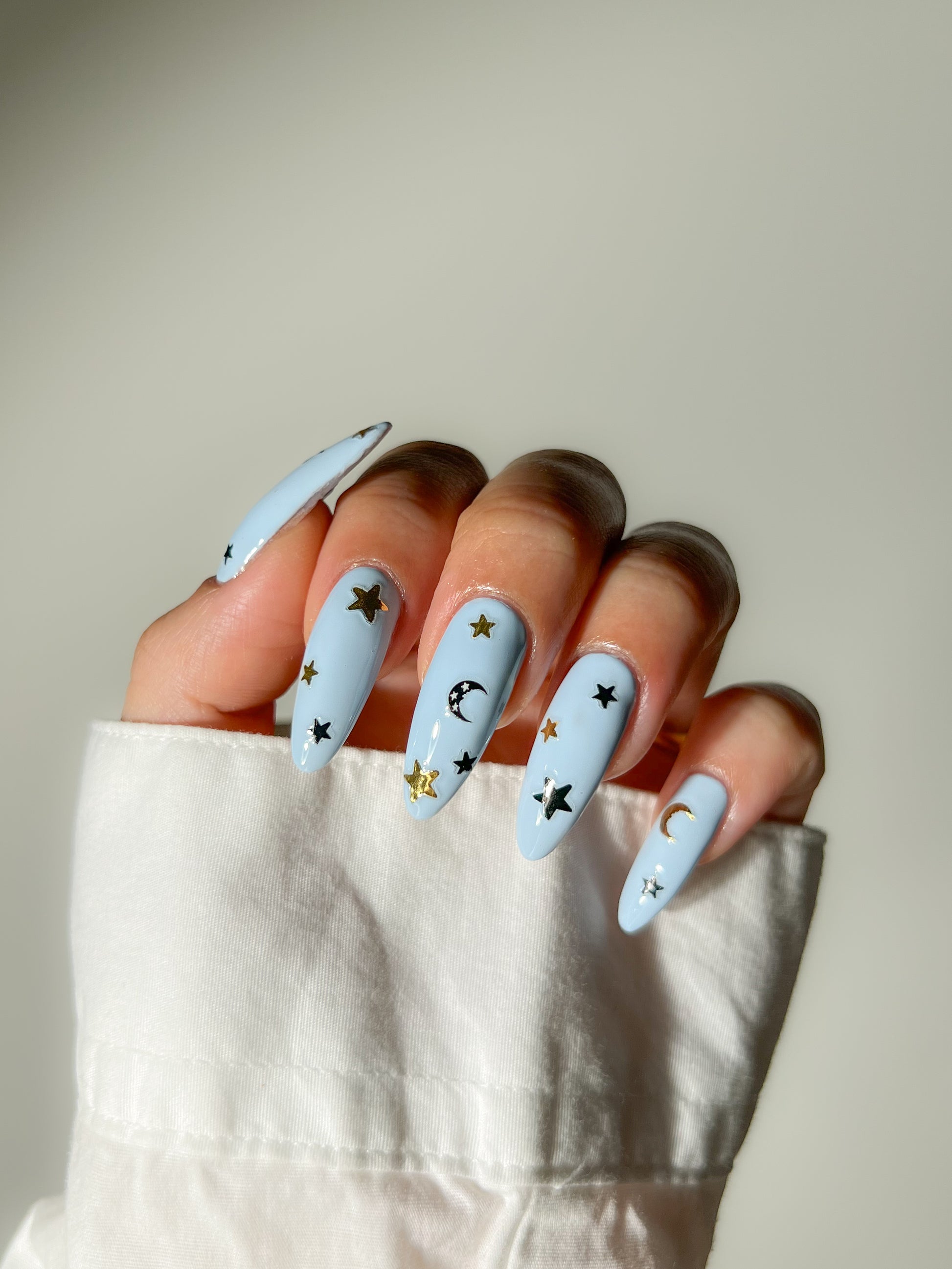Retrograde stickers on blue nails