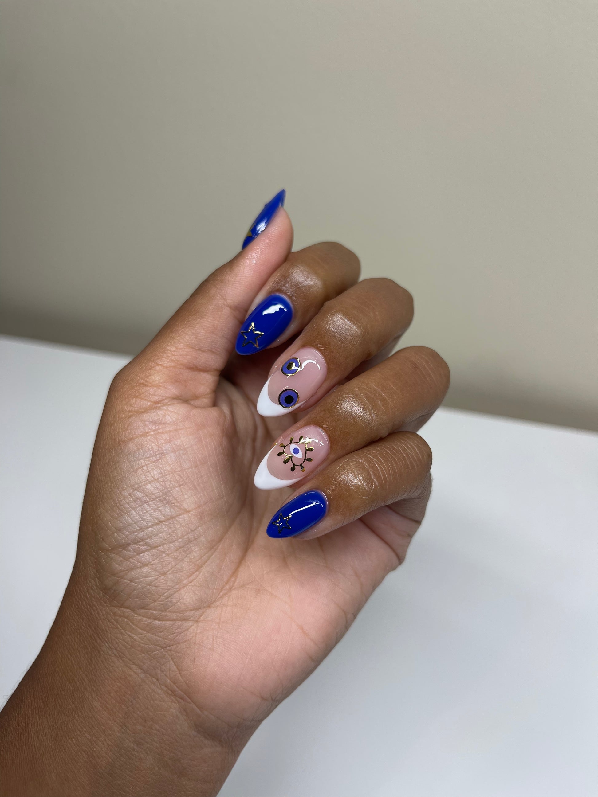 French tip and blue nails with stickers on