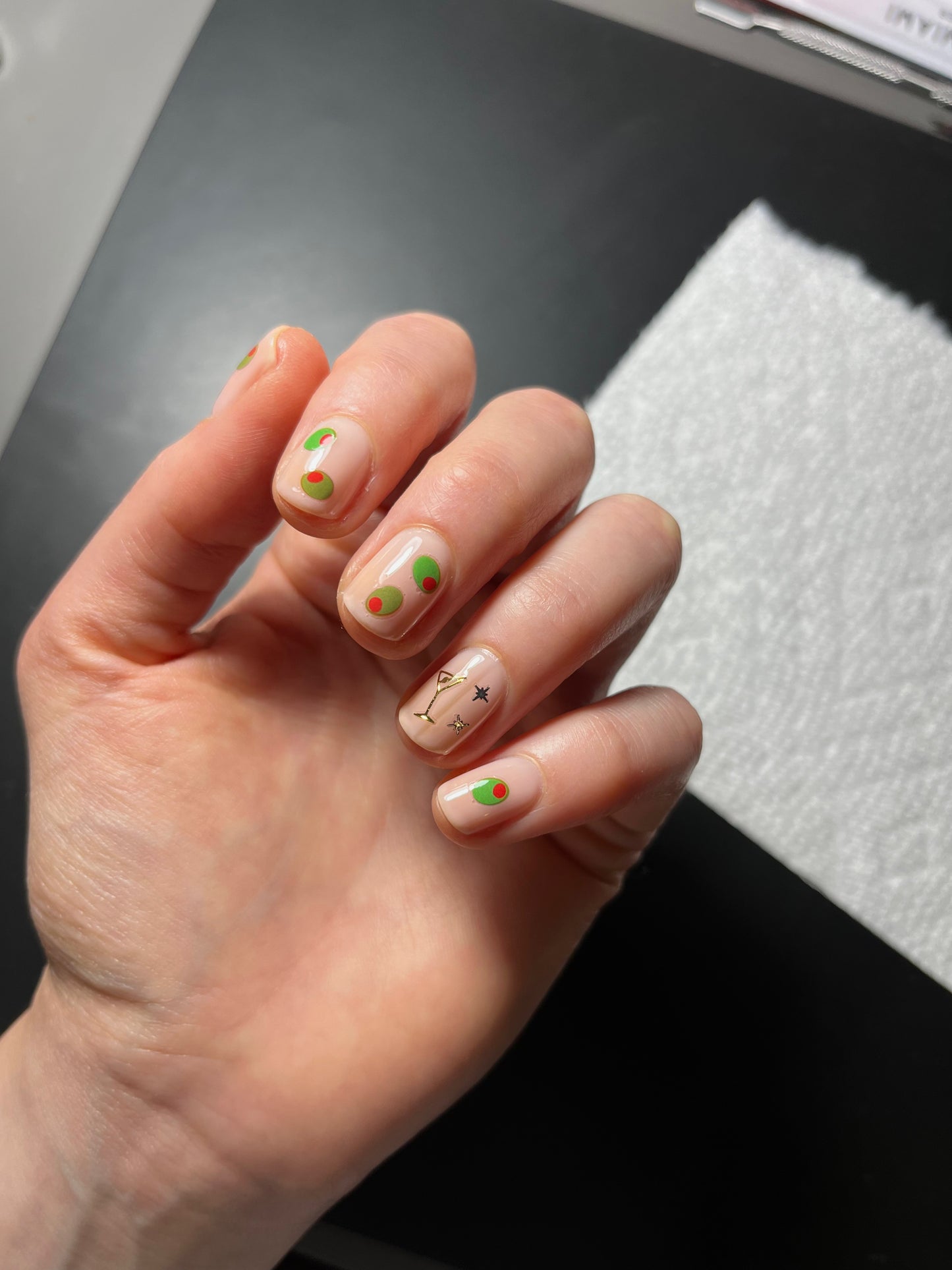 Olive stickers on nude nails