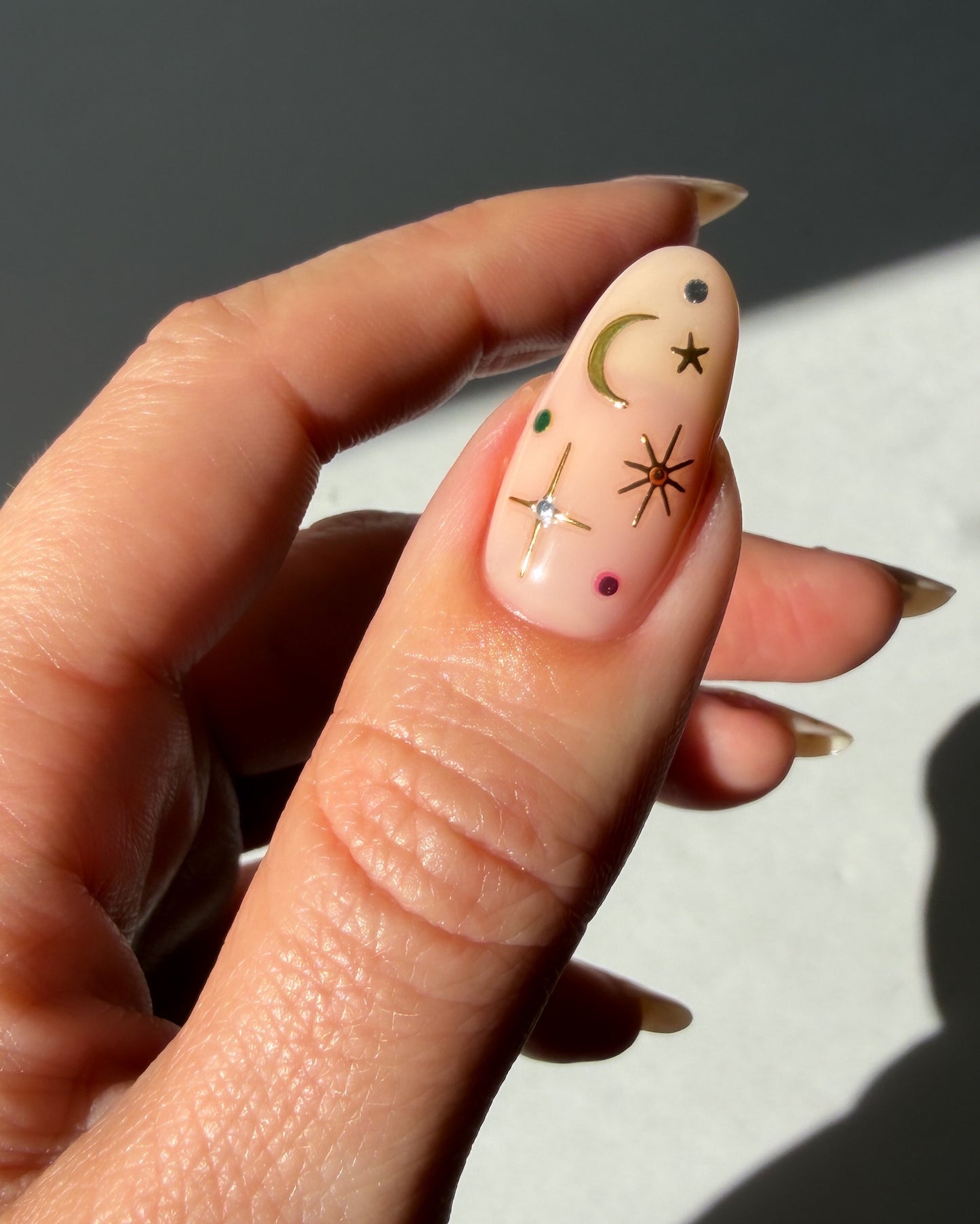 Stardust stickers on a nude nail