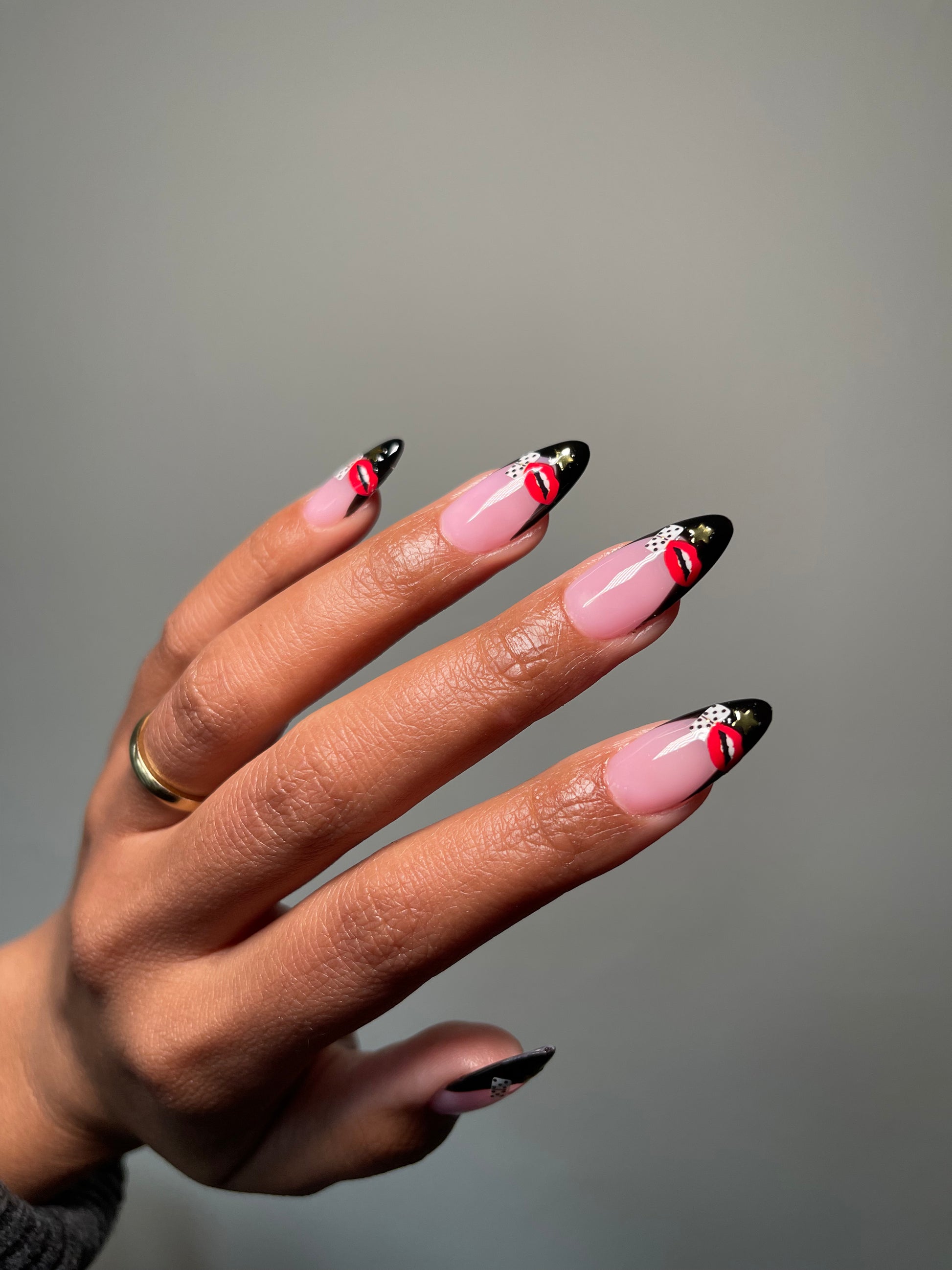 Black french tips with Sugar & Spice stickers on