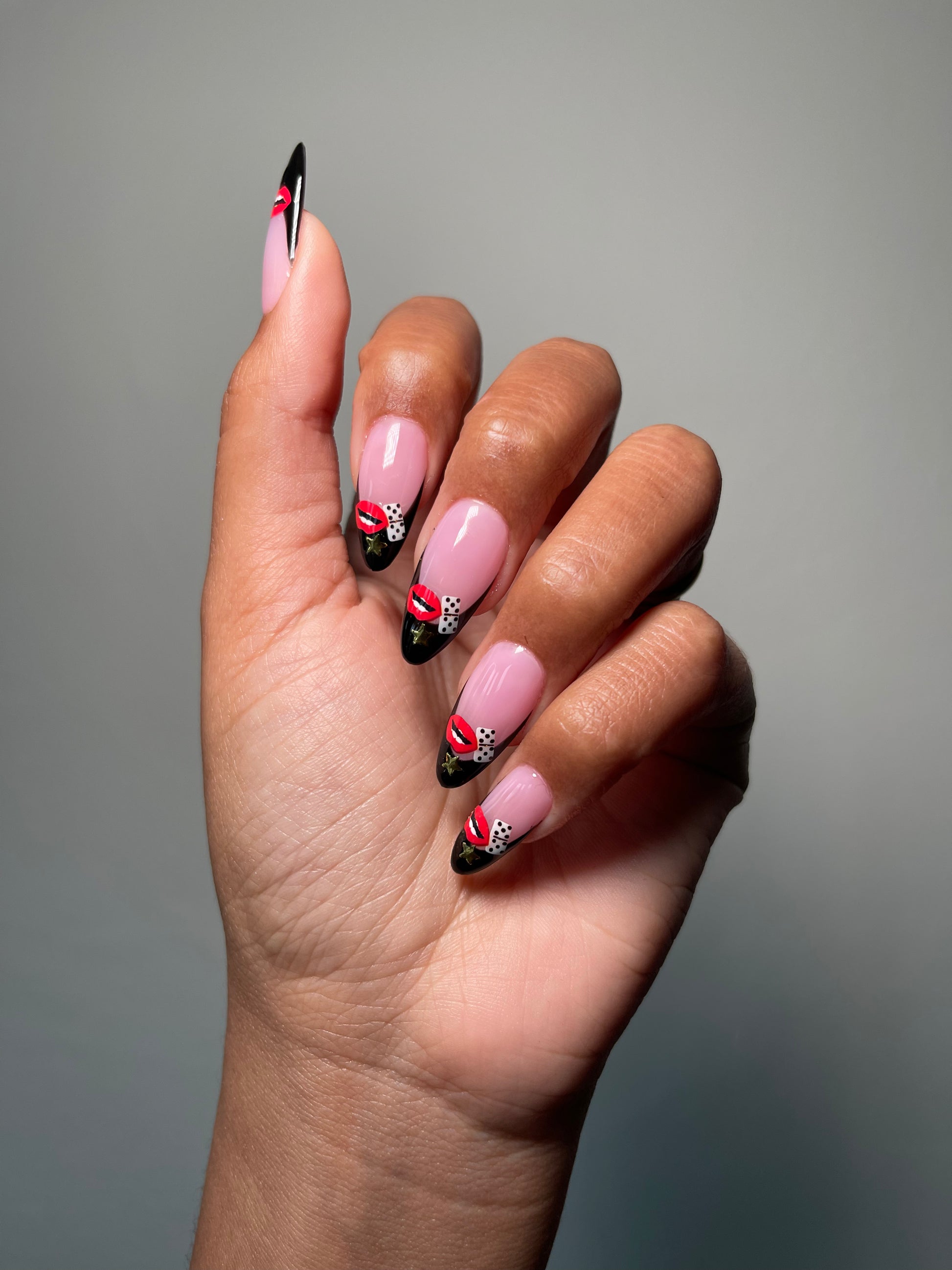 Black french tips with Sugar & Spice stickers on