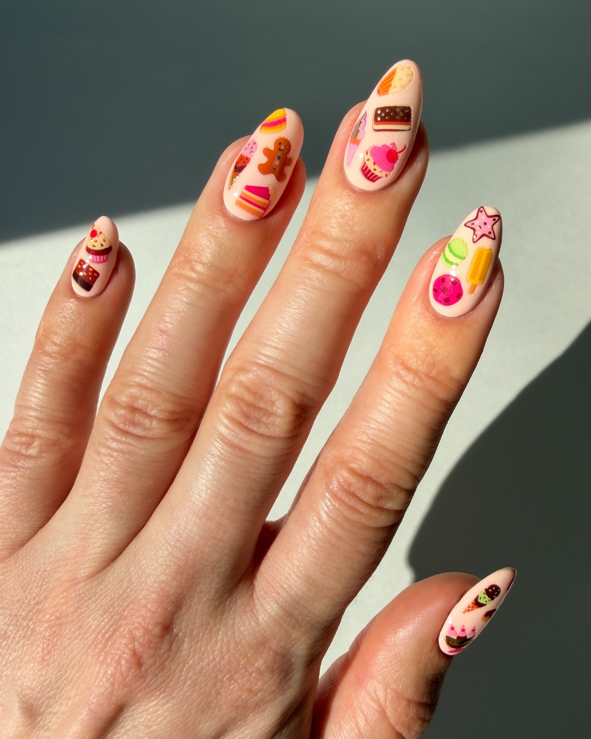 Dessert nail art stickers on peachy nails