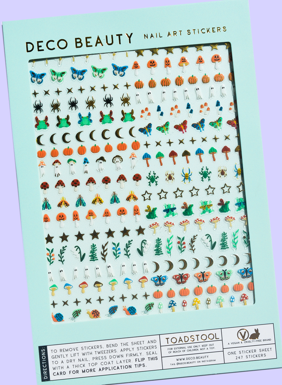 Toadstool nail art sticker sheet flat lay on a purple background