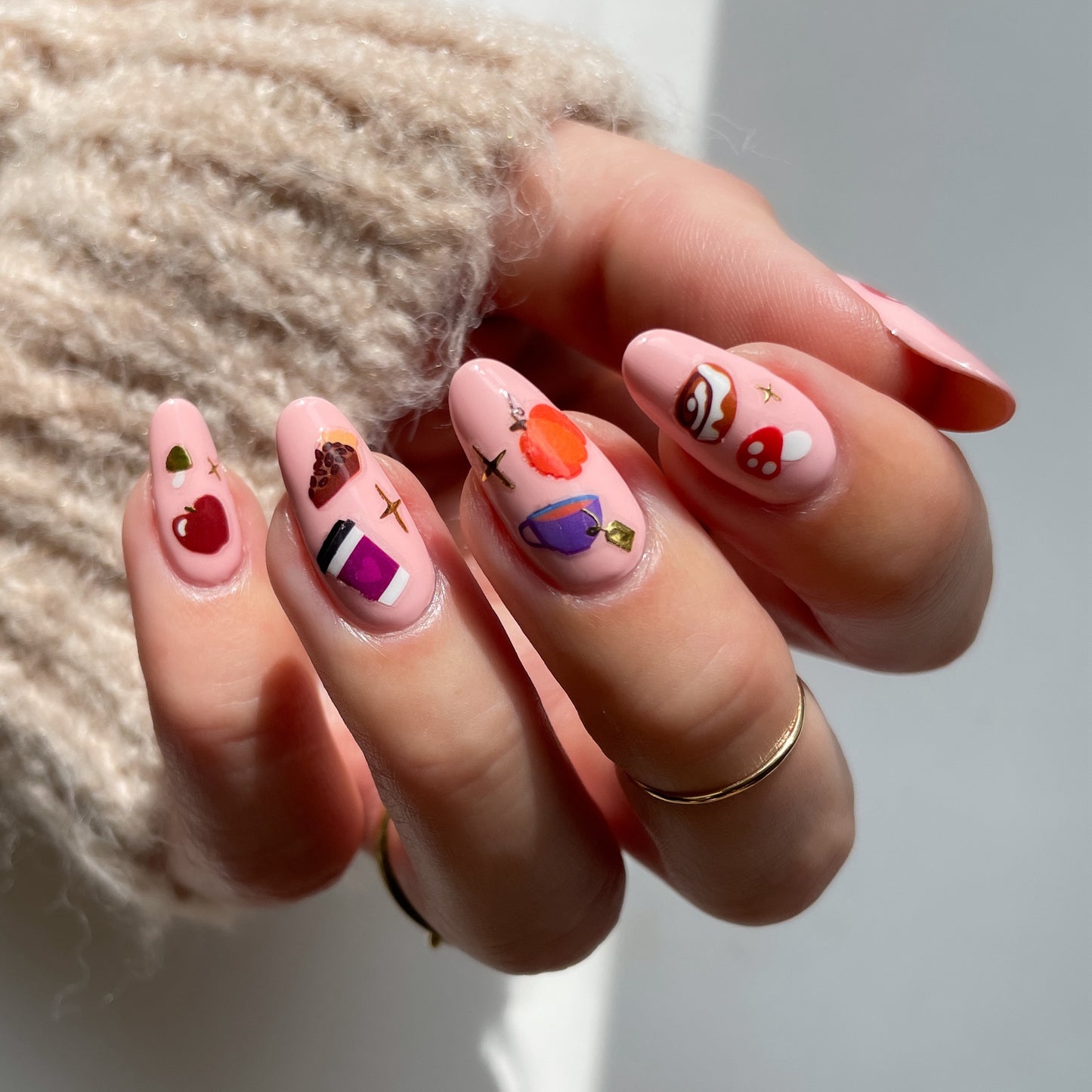 cozy stickerbook nails on a peachy base