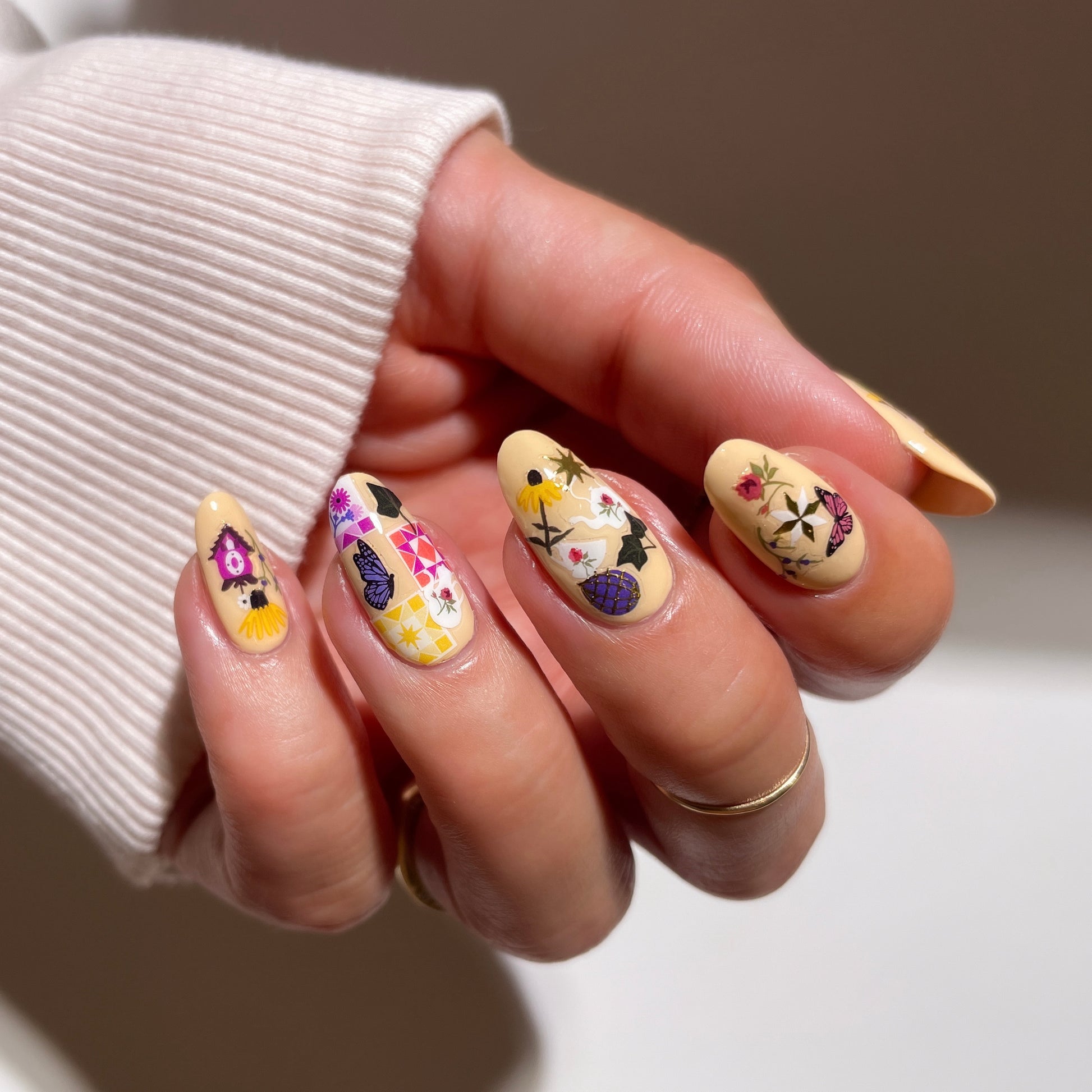 Hidden Hill stickers on yellow nails