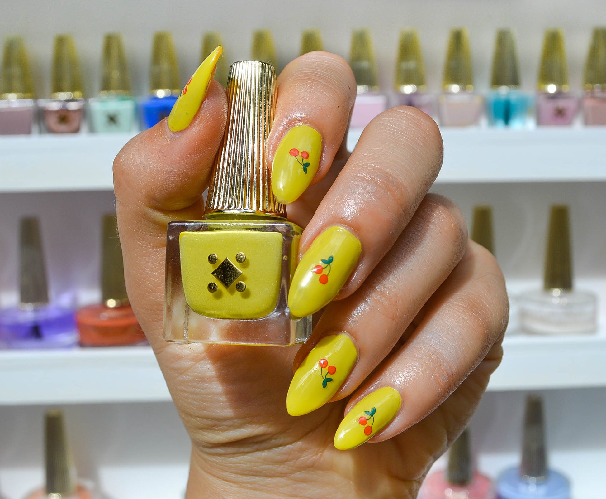 yellow nails with cherry art