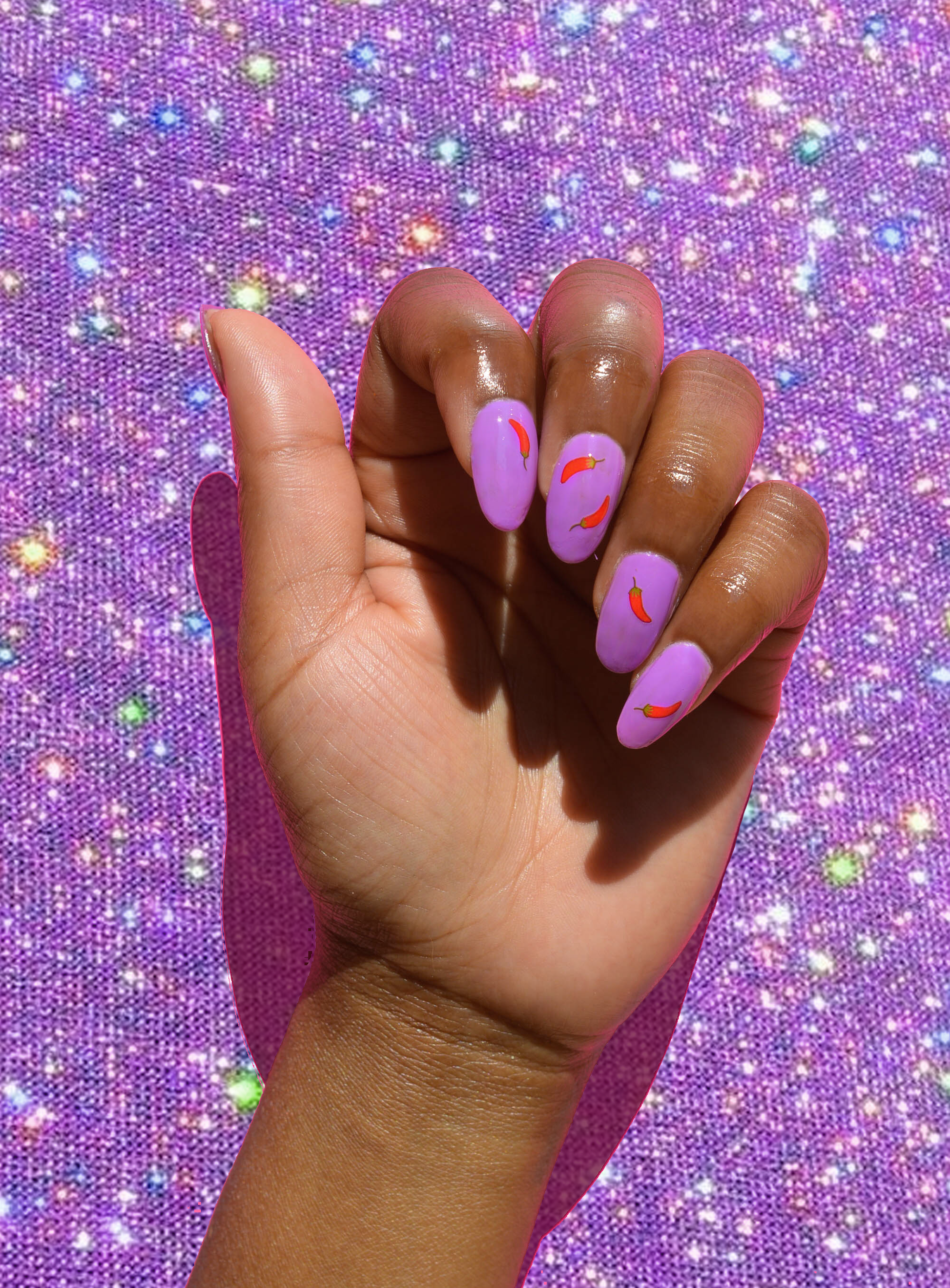 purple nails with chili stickers