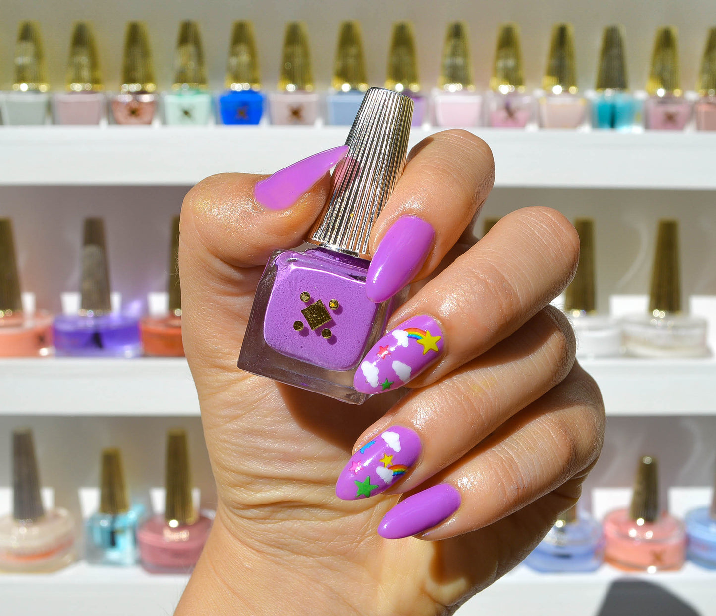 purple nails with rainbow stars clouds on accent nails