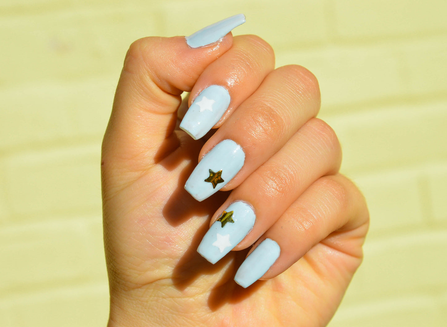 blue nails with gold and white stars